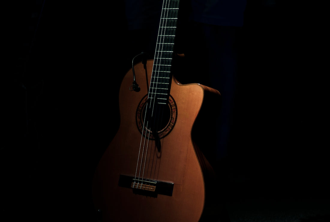 brown cutaway acoustic guitar
