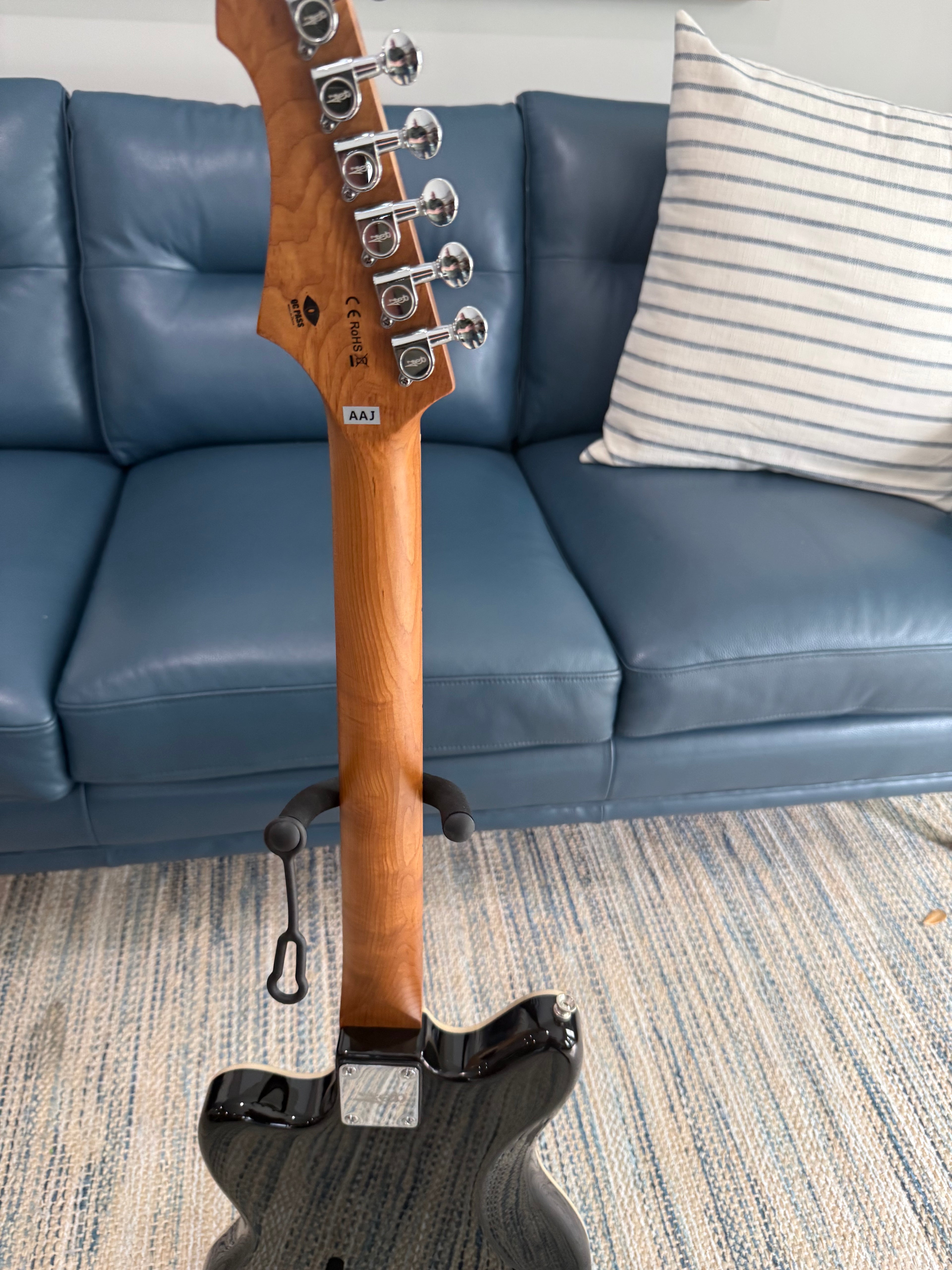 Palm Harbor Music JET JJ-350 BK electric guitar with black finish and sleek design, shown in a close-up view.