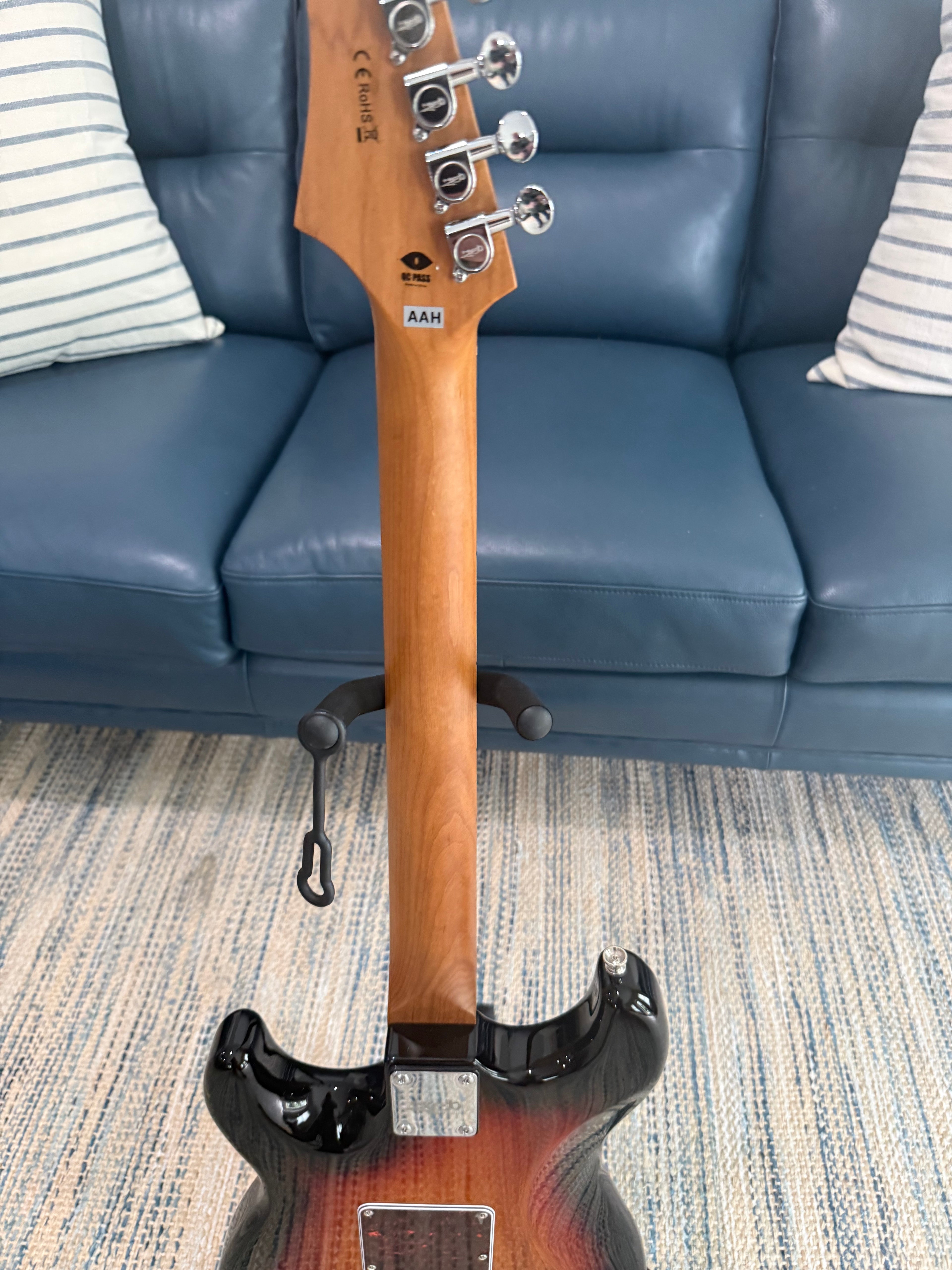 Close-up of a JET JS-300 SB electric guitar by Palm Harbor Music, showcasing its sleek body and detailed hardware.