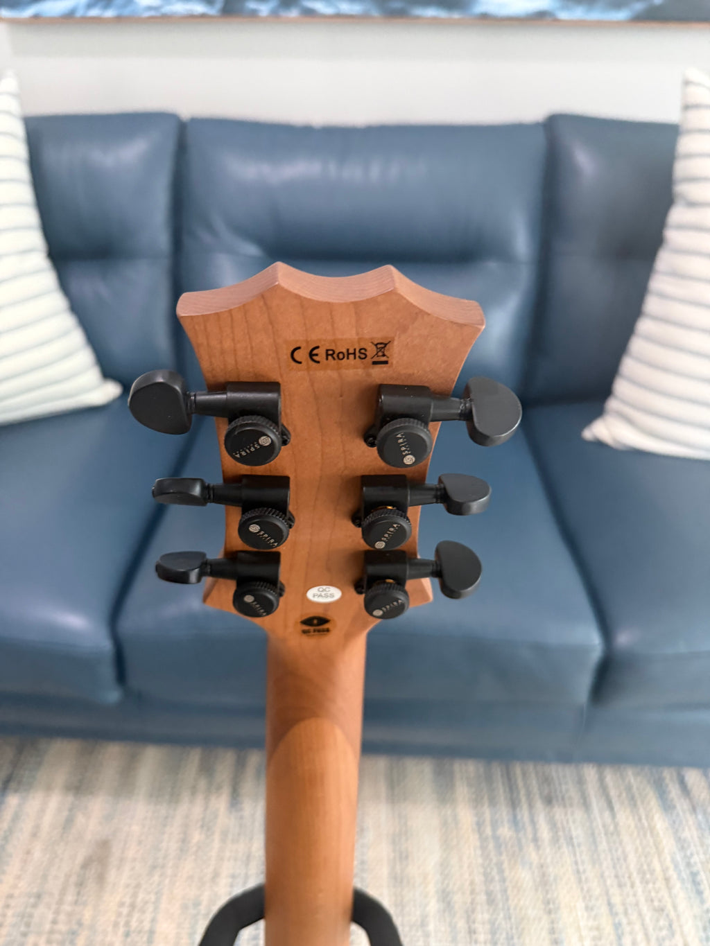Palm Harbor Music Spira L-400 MBK bass guitar with black finish, four strings, and ergonomic design.