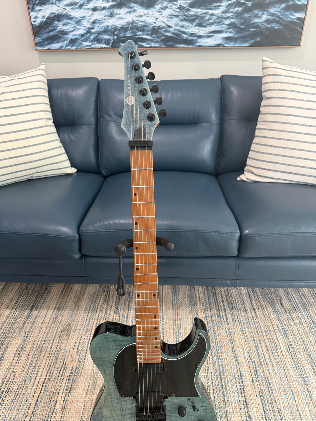 Palm Harbor Music Spira T-450 TDB guitar featuring a sleek body, fretboard, and tuning pegs visible in the image.