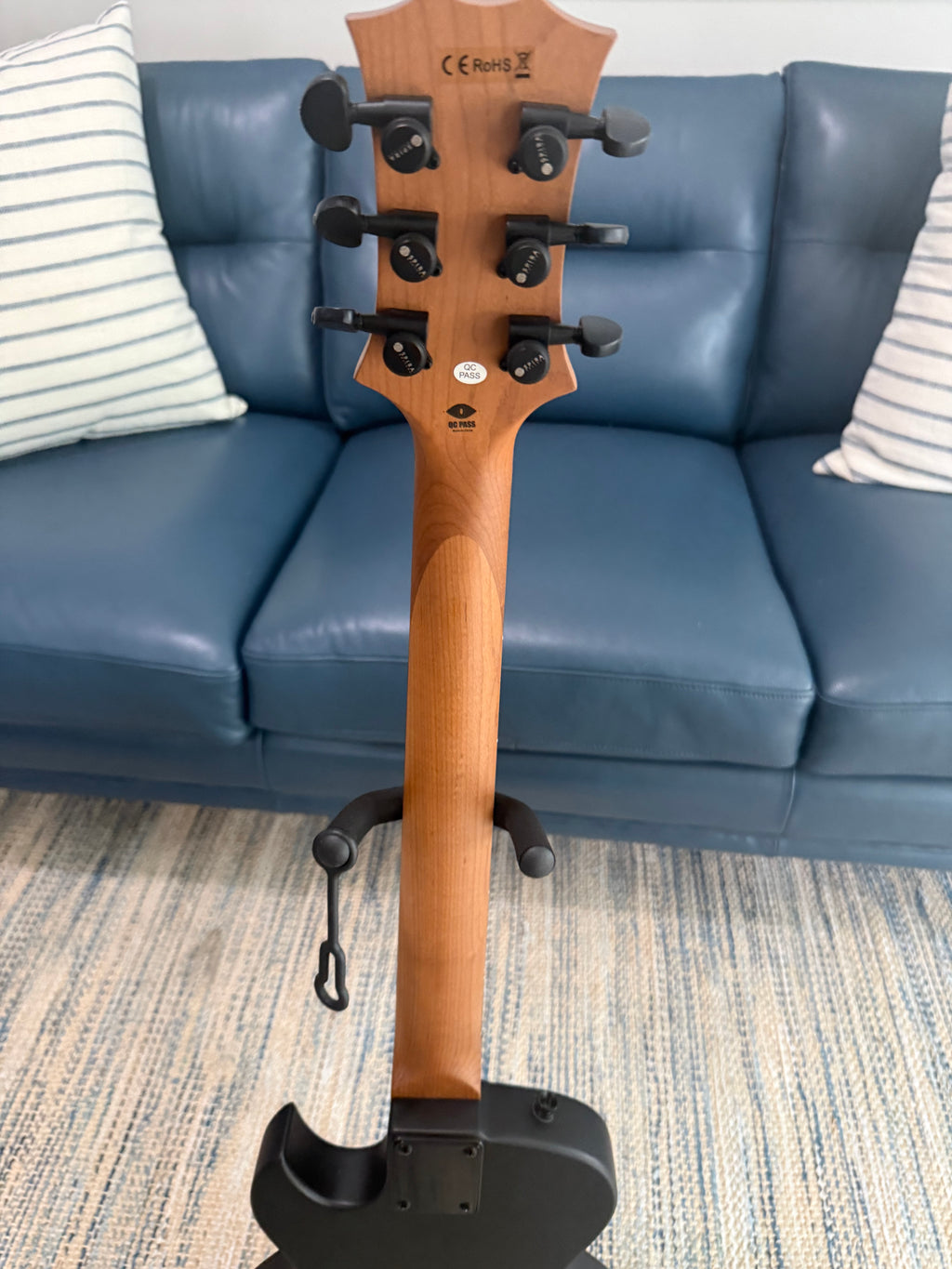 Palm Harbor Music Spira L-400 MBK acoustic guitar with black finish and steel strings, showing the full body and fretboard.