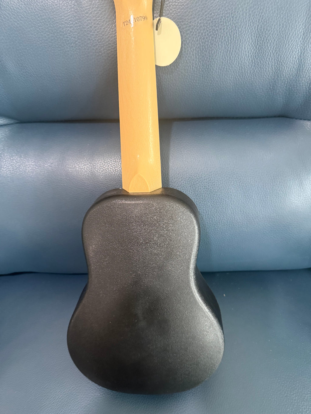 White Flight TUS-35 travel soprano ukulele with a smooth finish, compact size, and traditional ukulele shape.