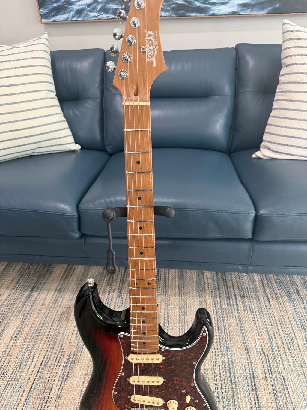 Palm Harbor Music JET JS-300 SB electric guitar with sunburst finish and chrome hardware, shown on a stand against a neutral background.