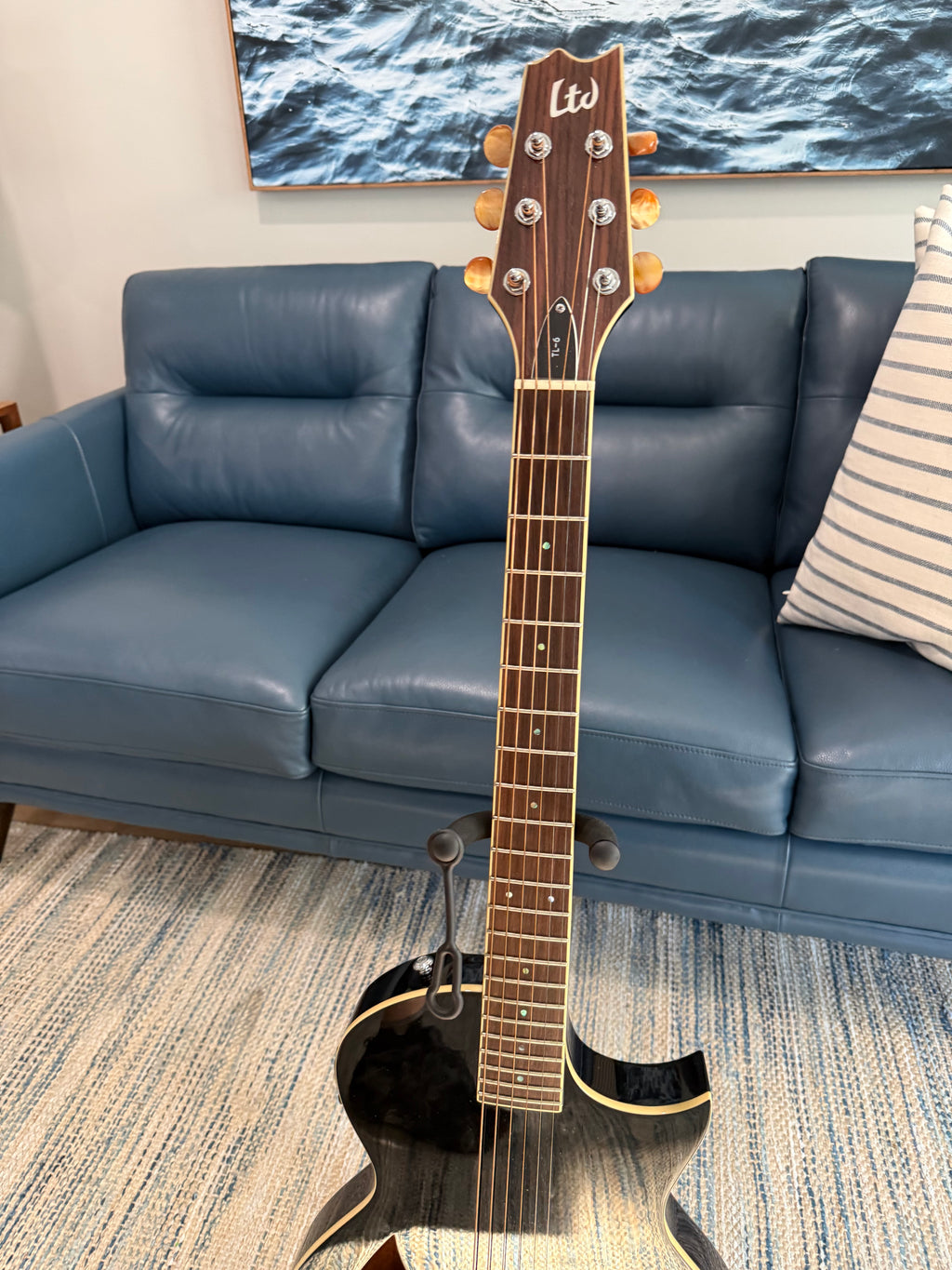 Black 2017 ESP LTD TL-6 electric guitar with rosewood fretboard and gig bag, showcasing the sleek body and hardware details.