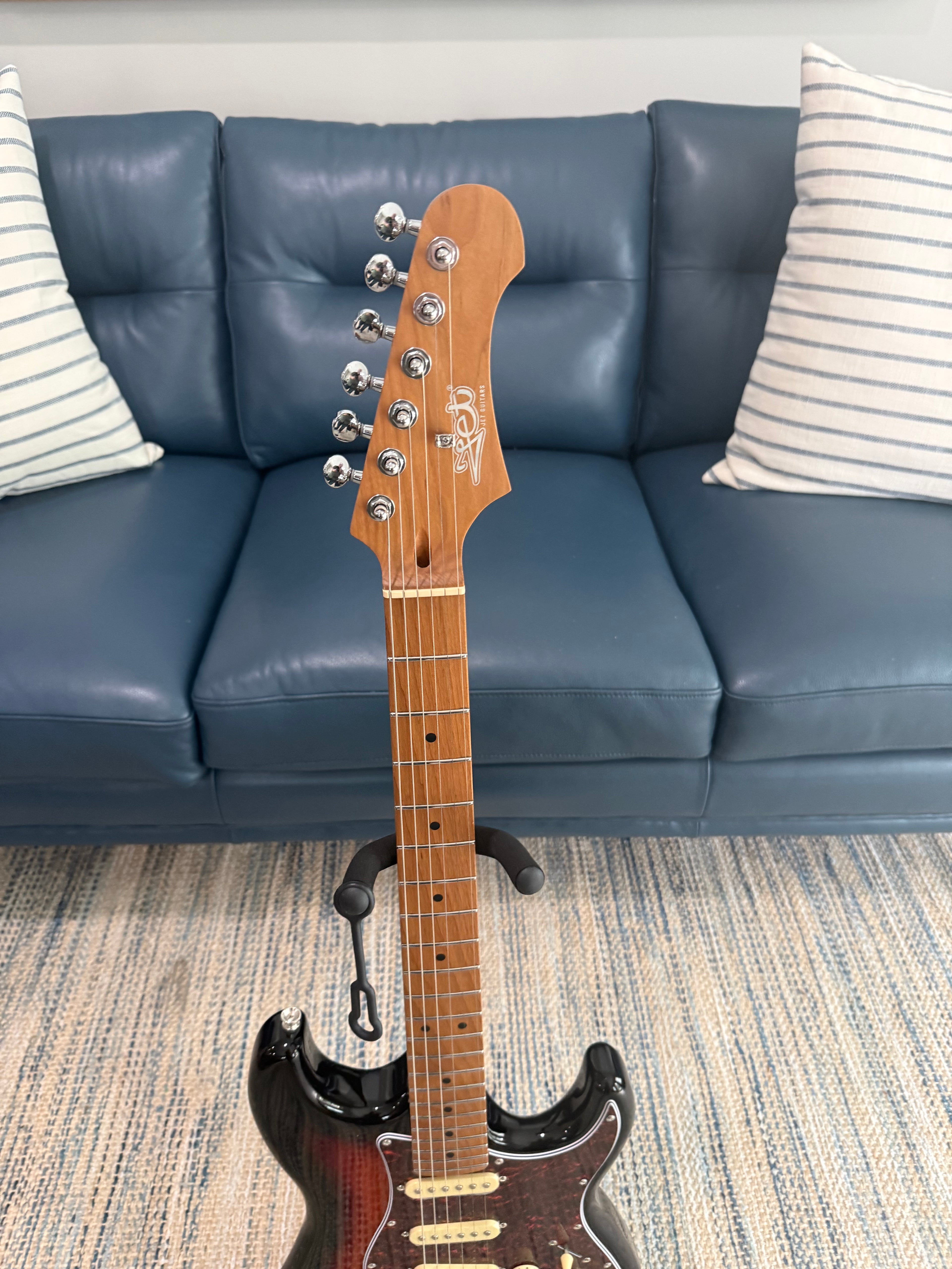Palm Harbor Music JET JS-300 SB electric guitar with a sleek black finish and modern design, shown in a close-up shot.