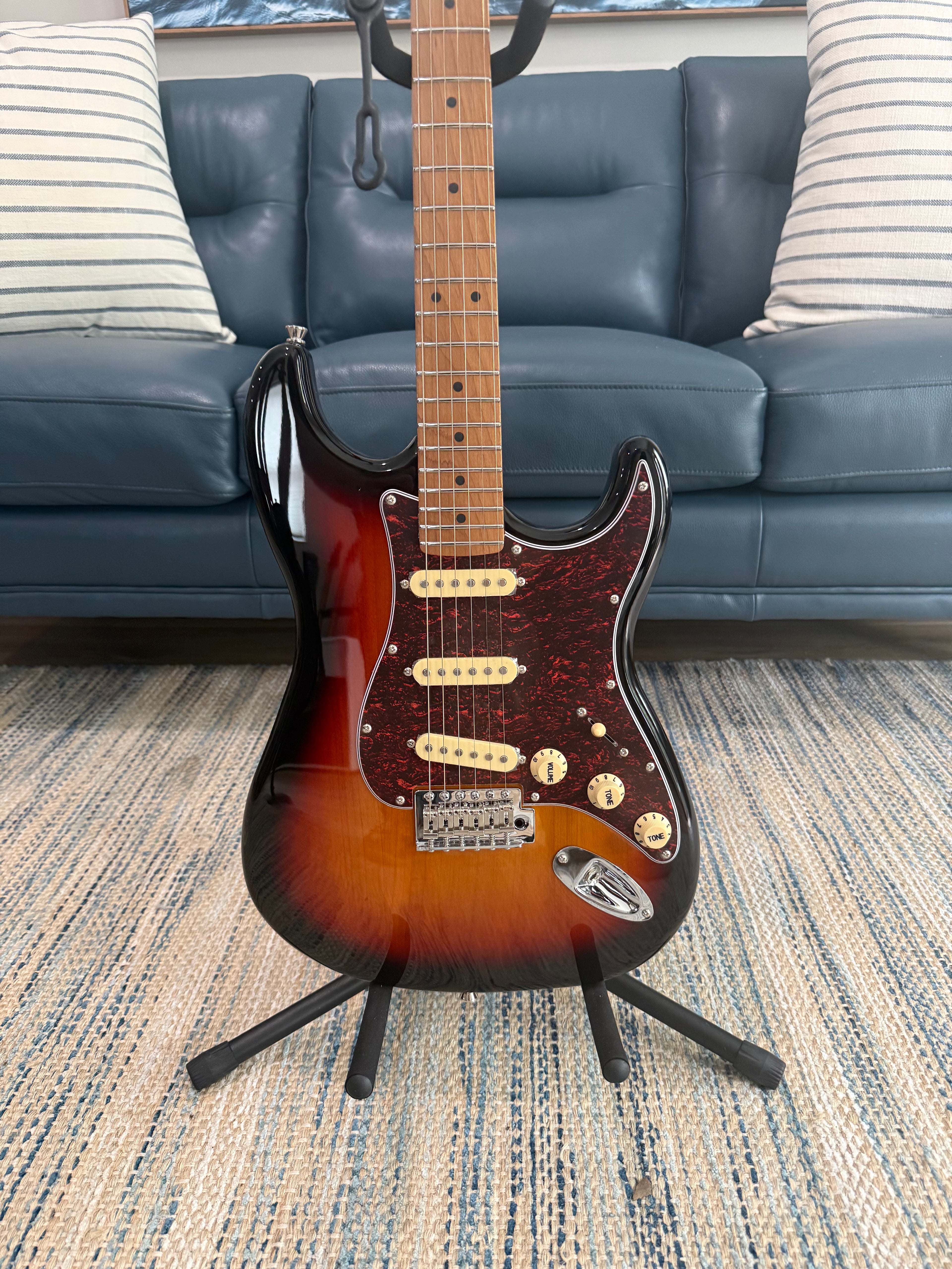 Palm Harbor Music JET JS-300 SB electric guitar with sunburst finish and chrome hardware, close-up of body and strings.