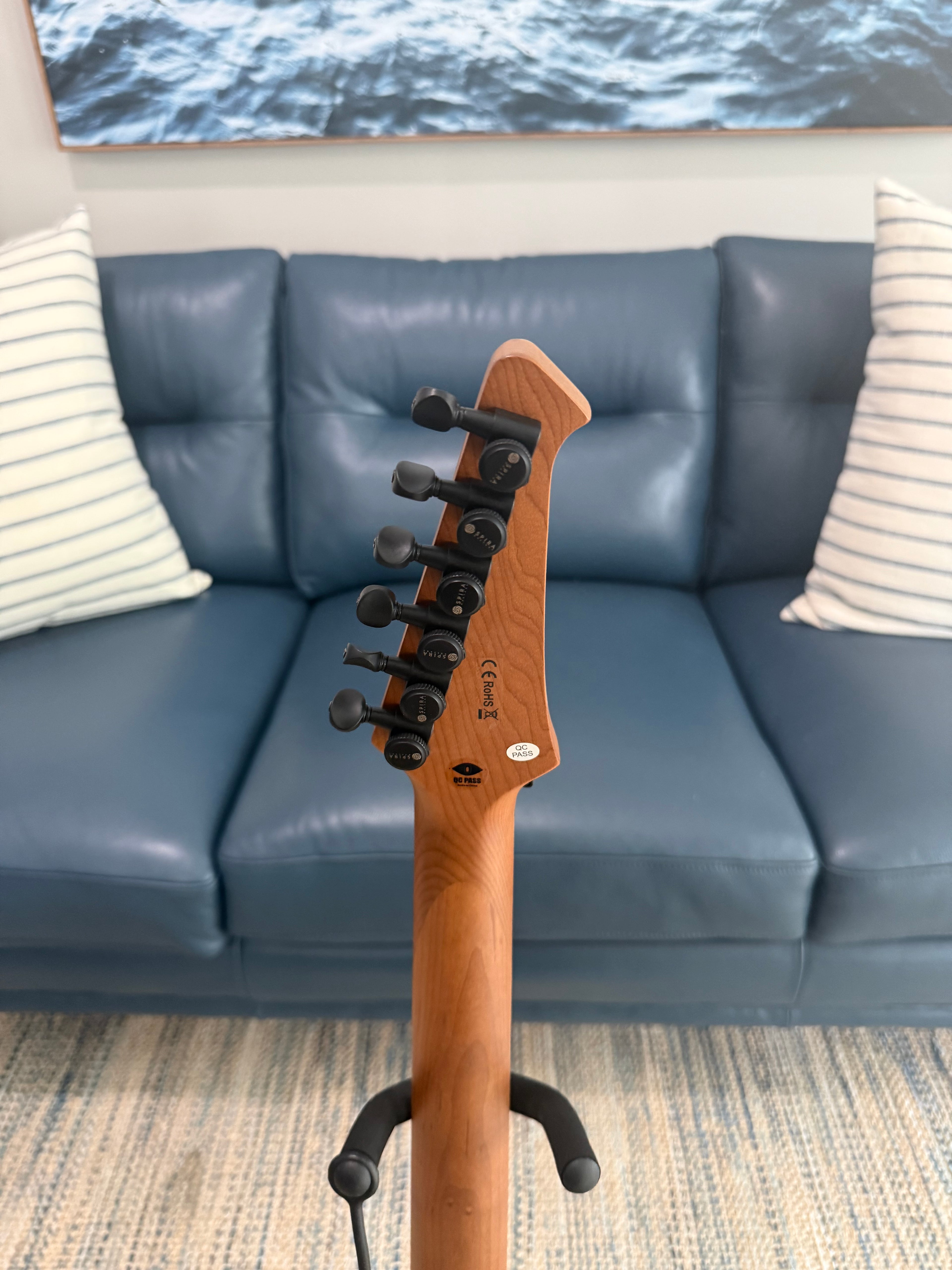 Palm Harbor Music Spira S-500 QAB acoustic guitar with natural wood finish and steel strings, showing the front view of the instrument.