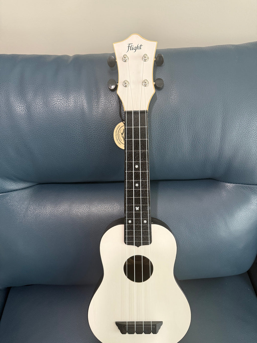 White Flight TUS-35 travel soprano ukulele with smooth finish and compact design, ideal for travel and beginner players.