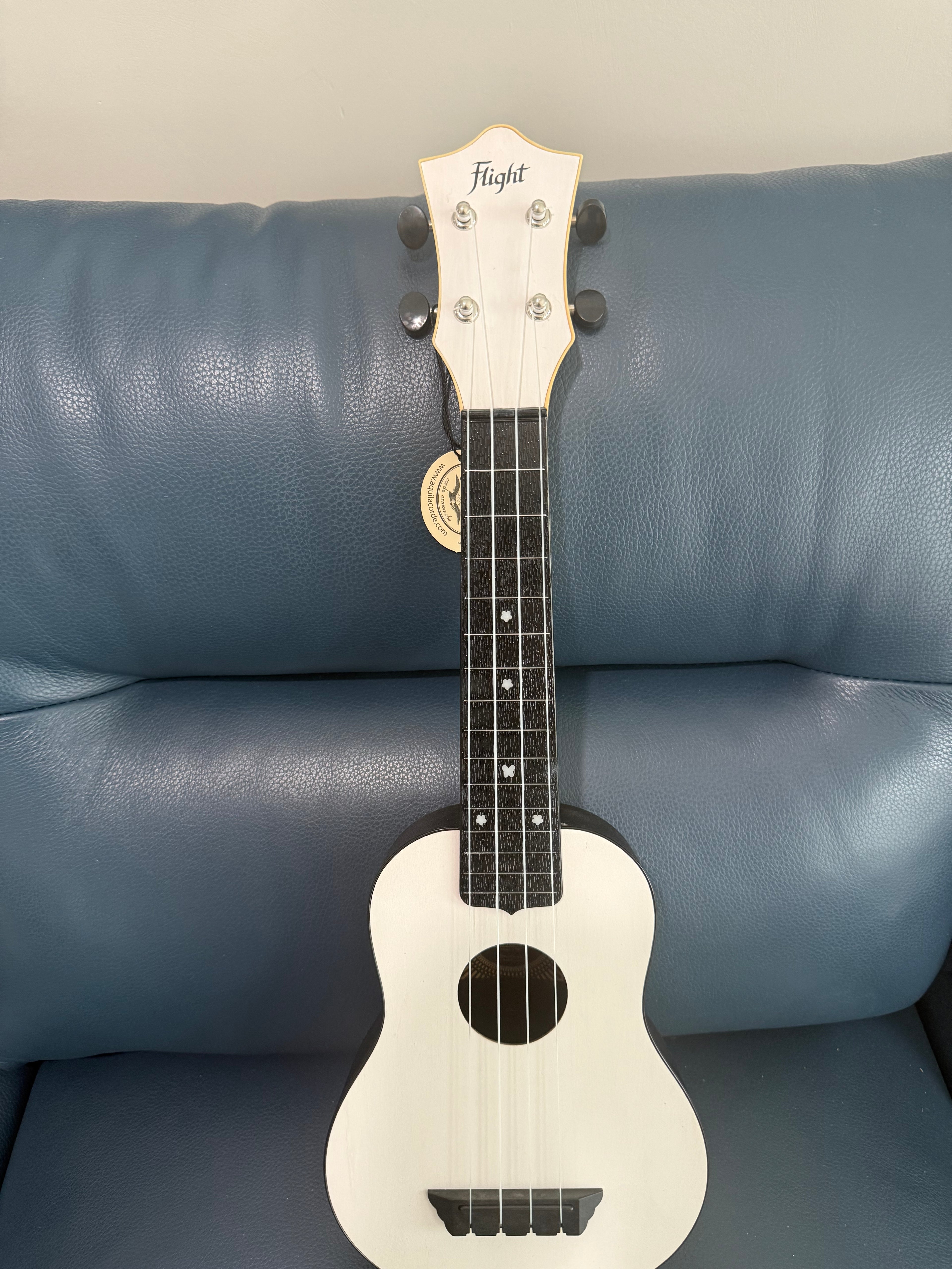 White Flight TUS-35 travel soprano ukulele with smooth finish and compact design, ideal for travel and beginner players.