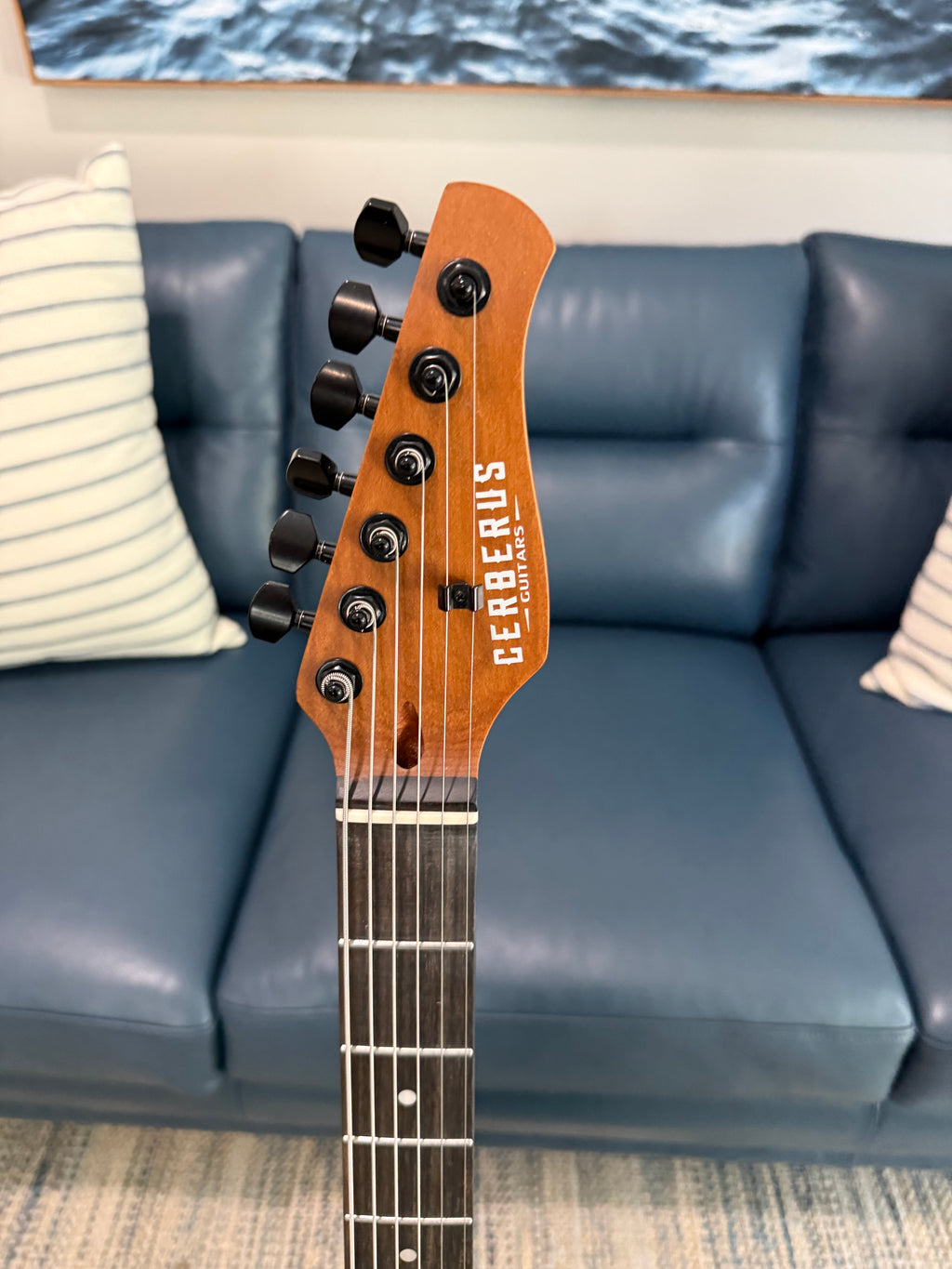 Cerberus Hermes 6HT Baritone guitar with granite sparkle finish, showcasing its sleek design and polished appearance.