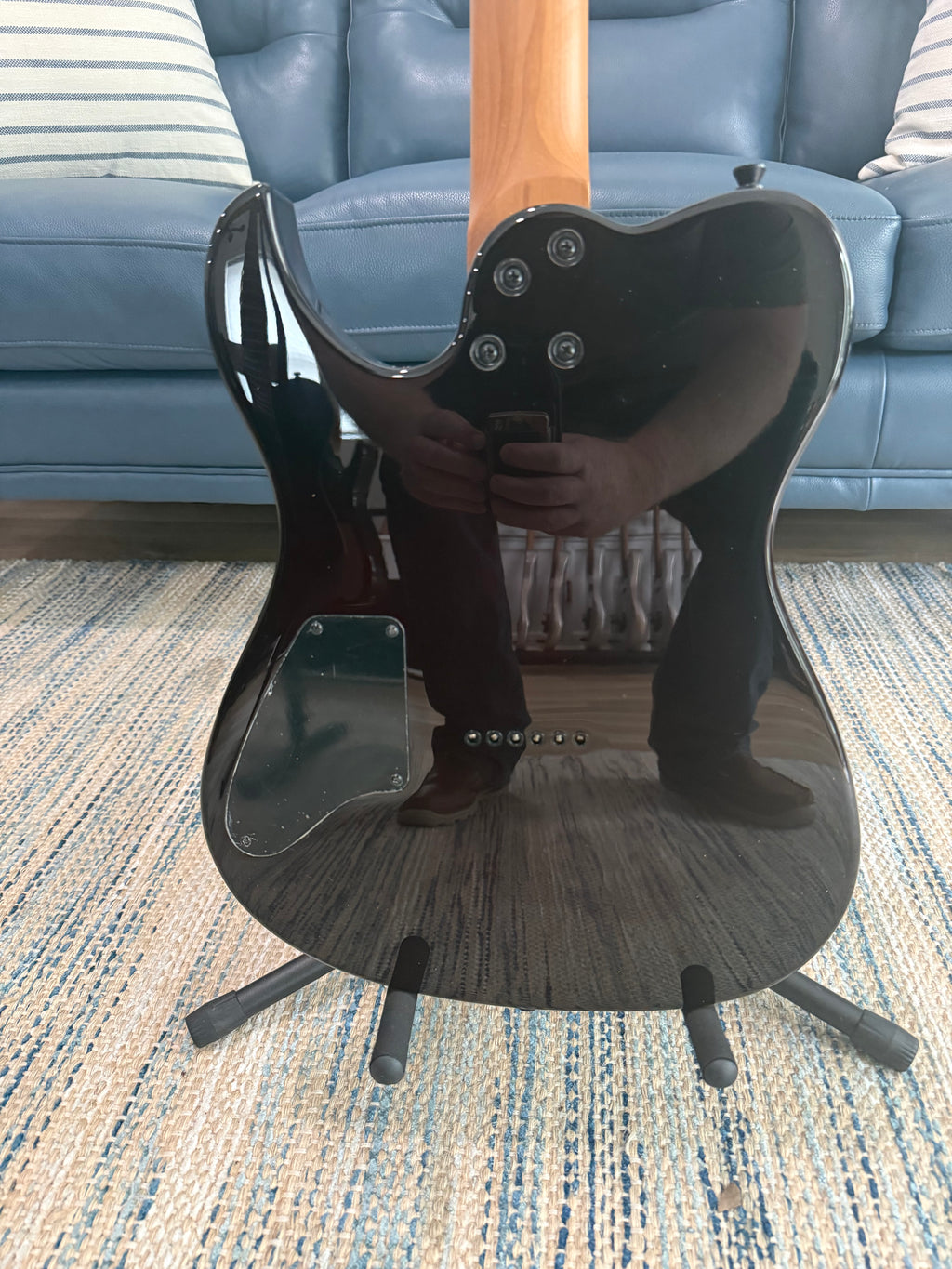Palm Harbor Music Spira T-450 TDB guitar with a sleek black finish and ergonomic design, showing the front view of the instrument.