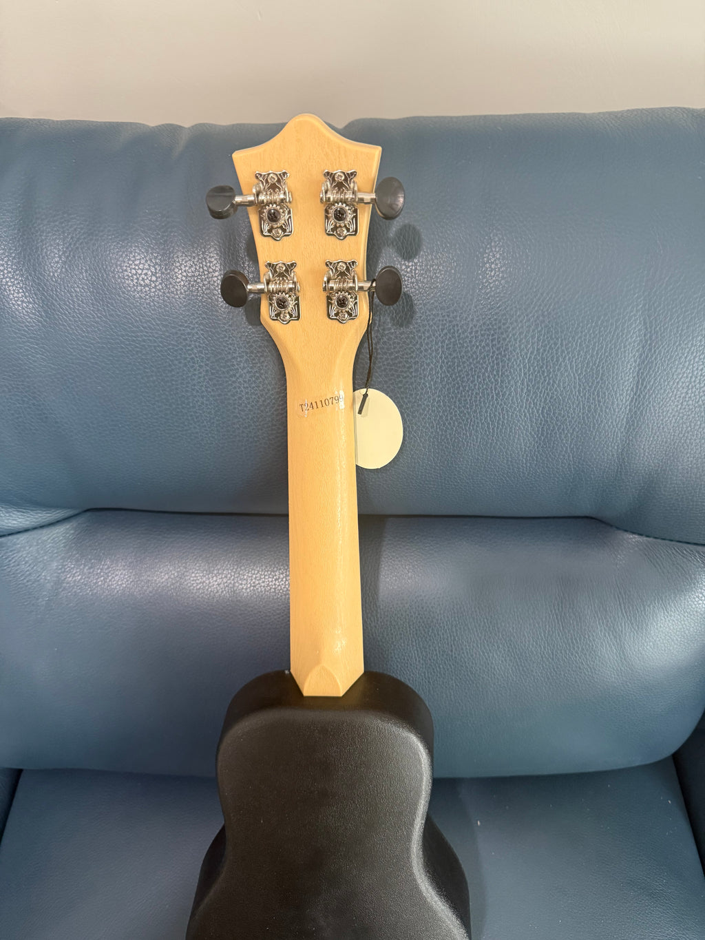 White Flight TUS-35 travel soprano ukulele with a smooth finish, compact size, and sleek design for on-the-go playing.