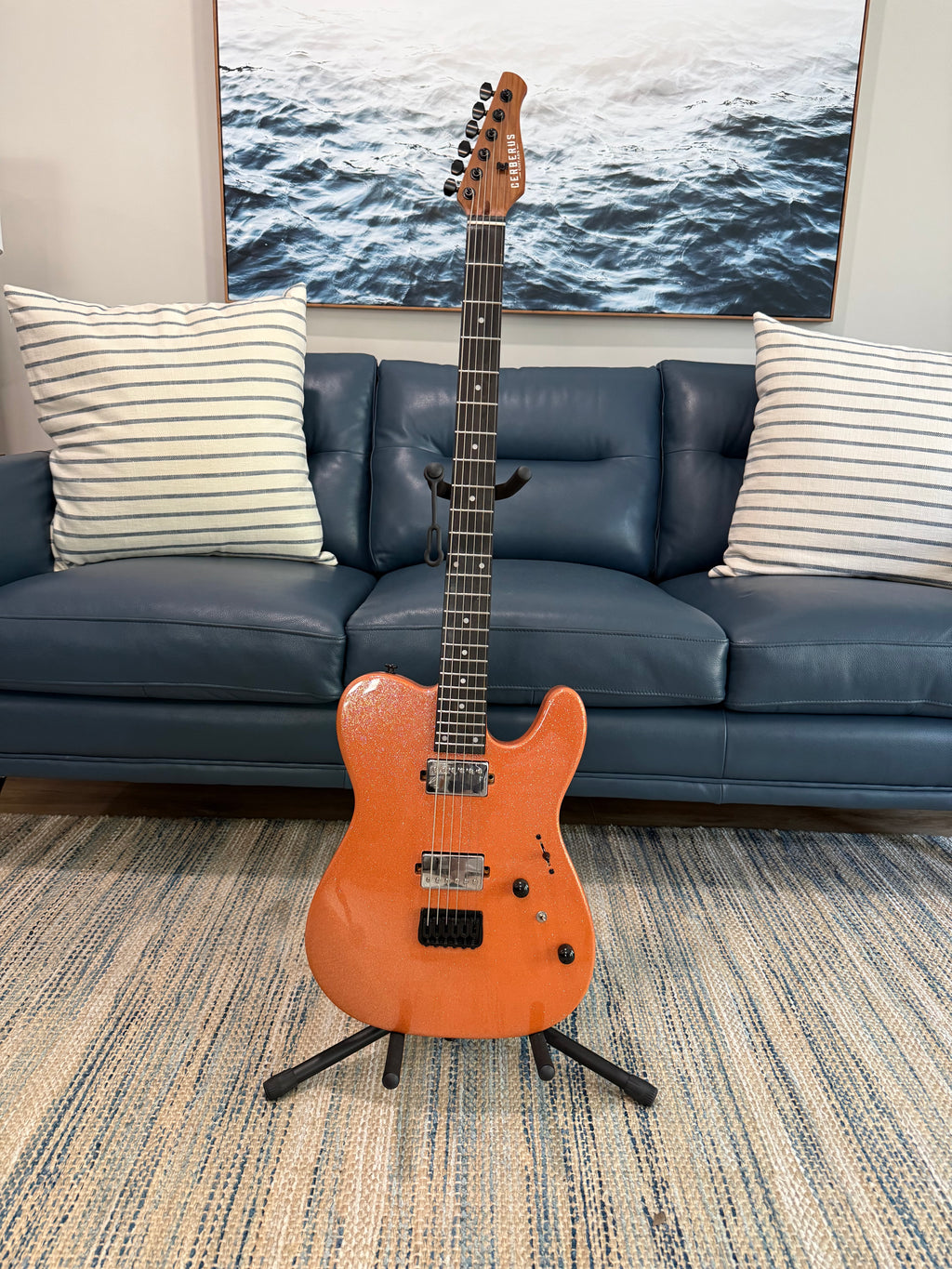 Cerberus Hermes 6HT Baritone saxophone in orange sparkle finish, showcasing its sleek design and vibrant color.