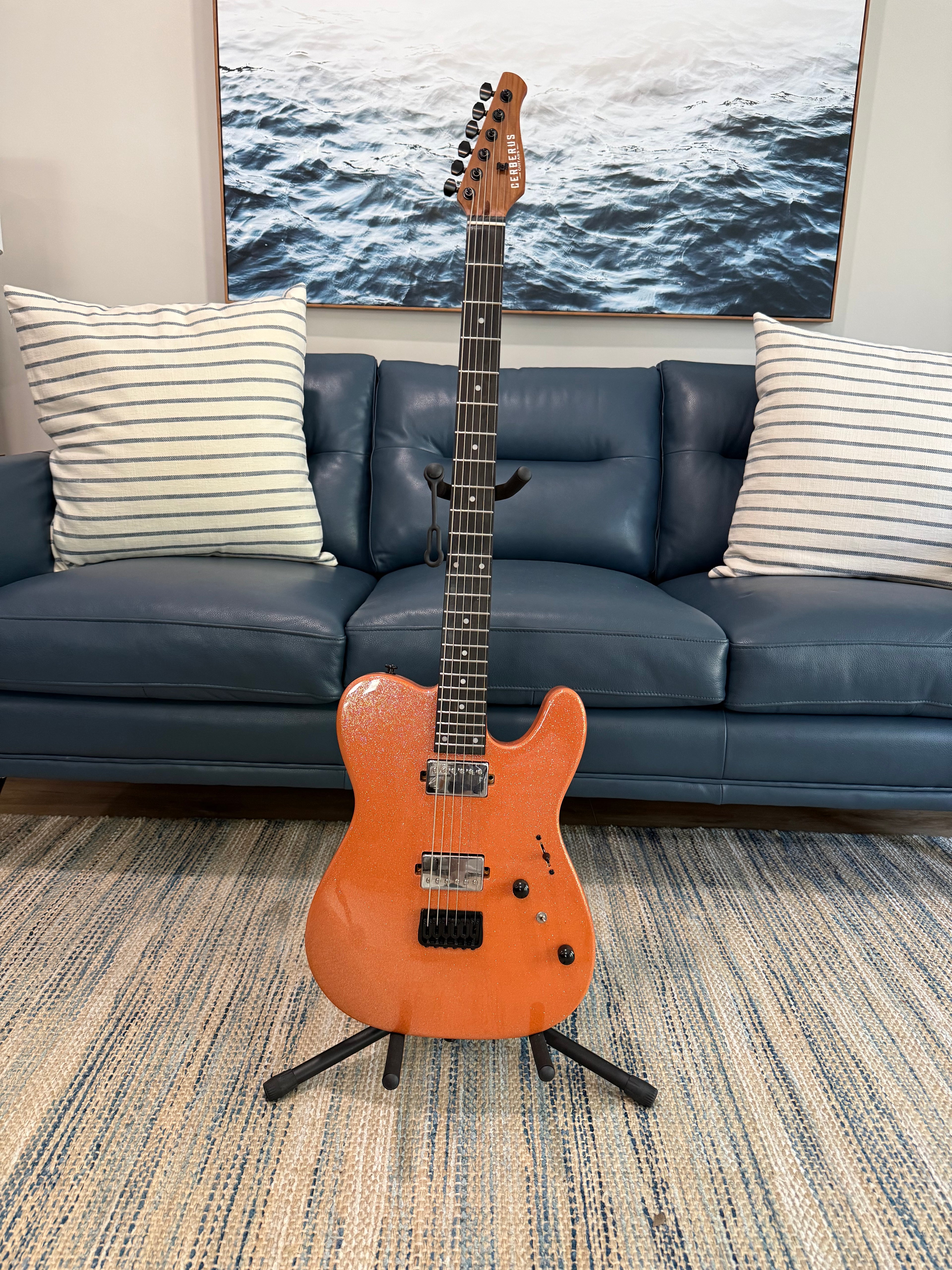 Cerberus Hermes 6HT Baritone saxophone in orange sparkle finish, showcasing its sleek design and vibrant color.
