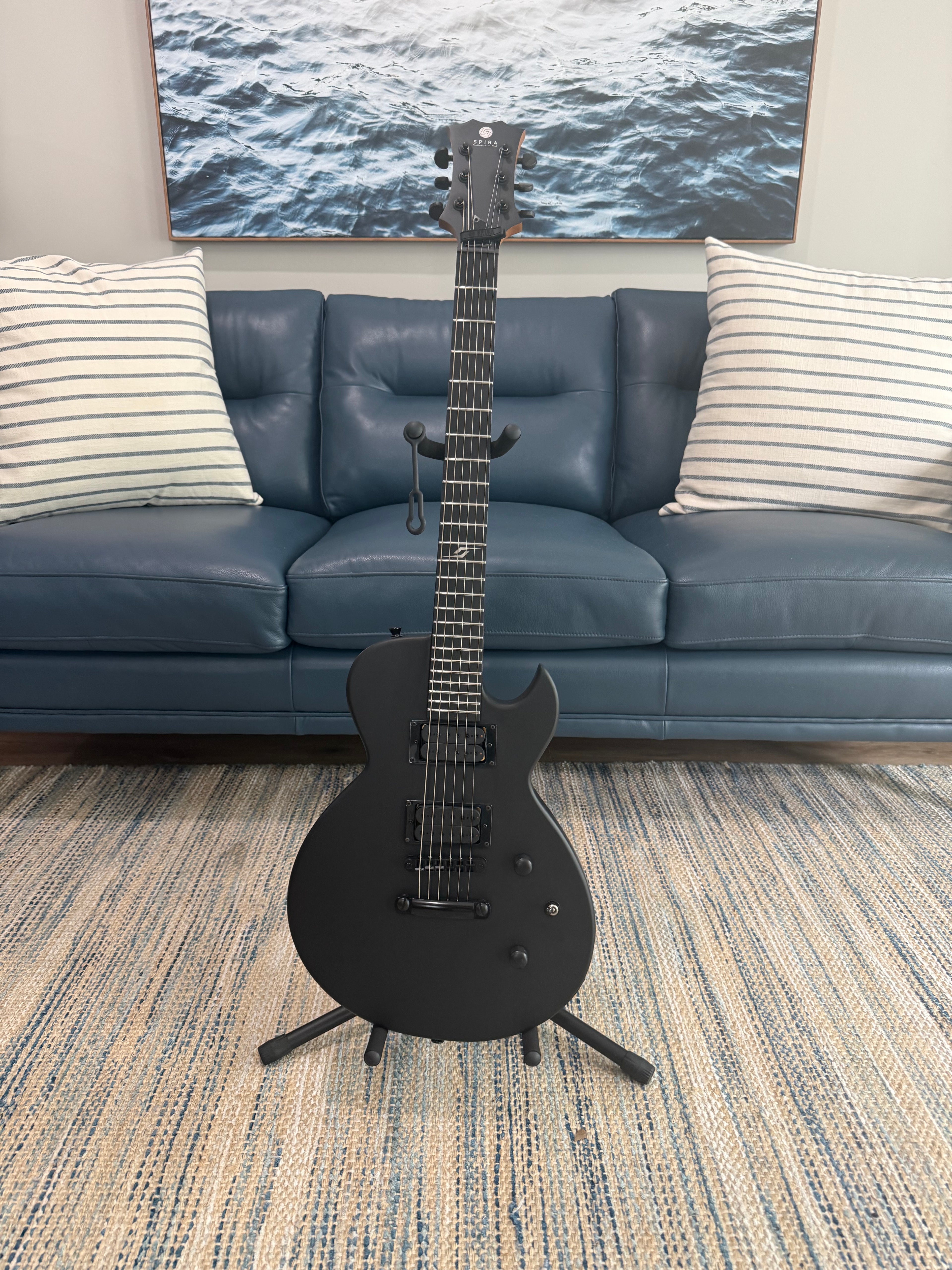 Palm Harbor Music Spira L-400 MBK instrument, black finish, with strings and tuning pegs visible in the image.