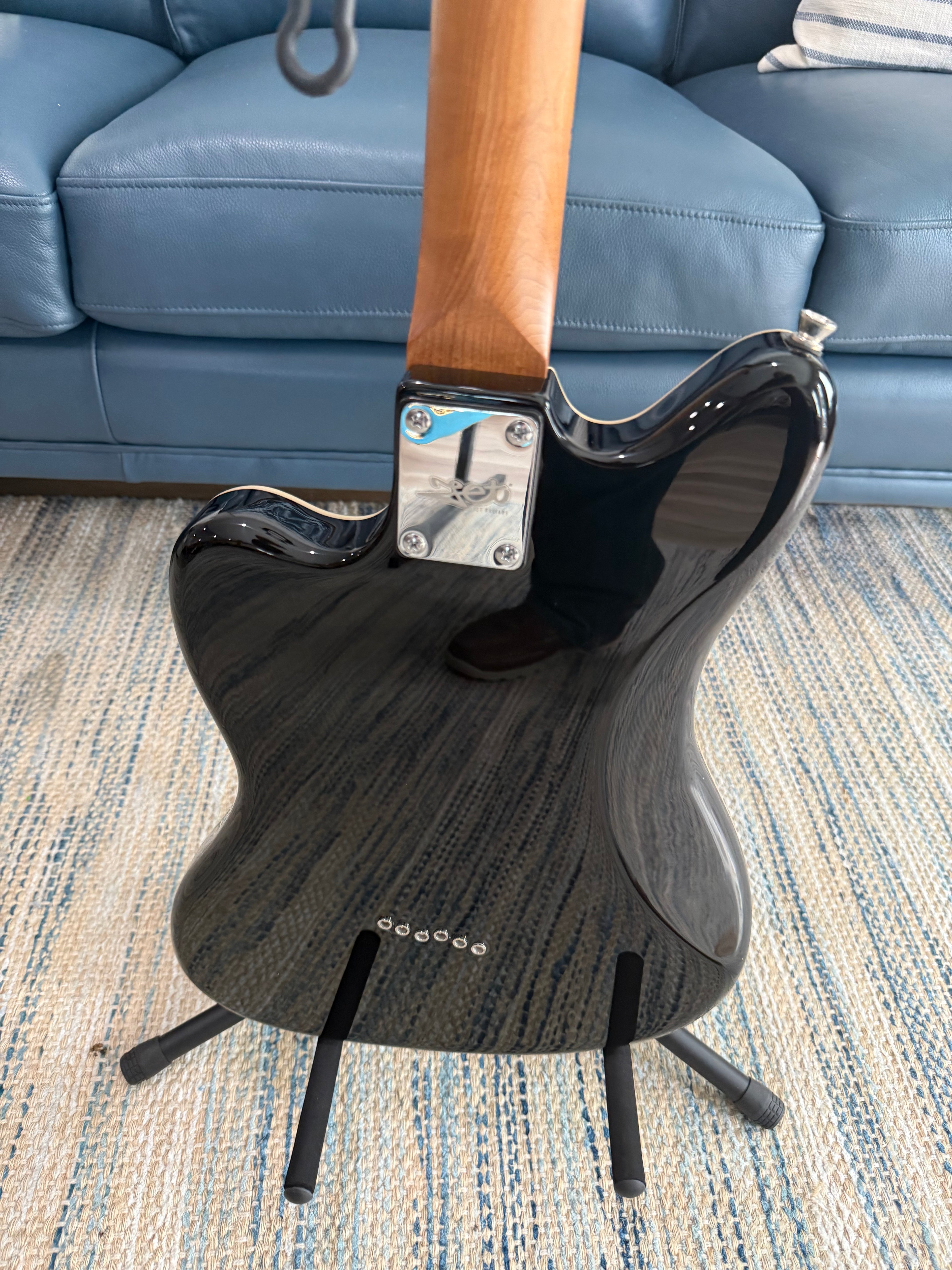 Palm Harbor Music JET JJ-350 BK electric guitar in black with a sleek body and six strings, displayed on a plain background.