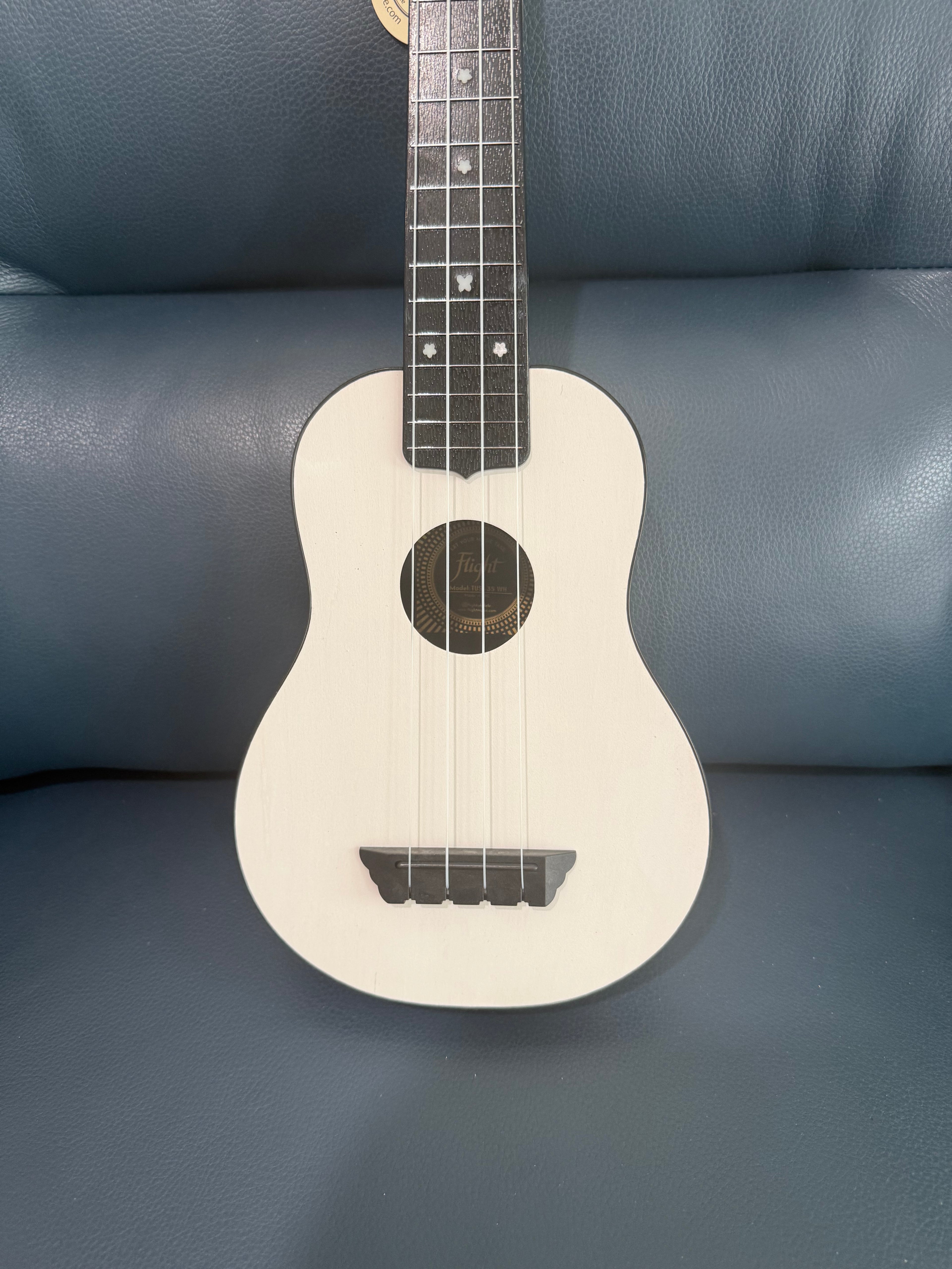 White Flight TUS-35 travel soprano ukulele with a smooth finish and compact size, ideal for on-the-go playing.