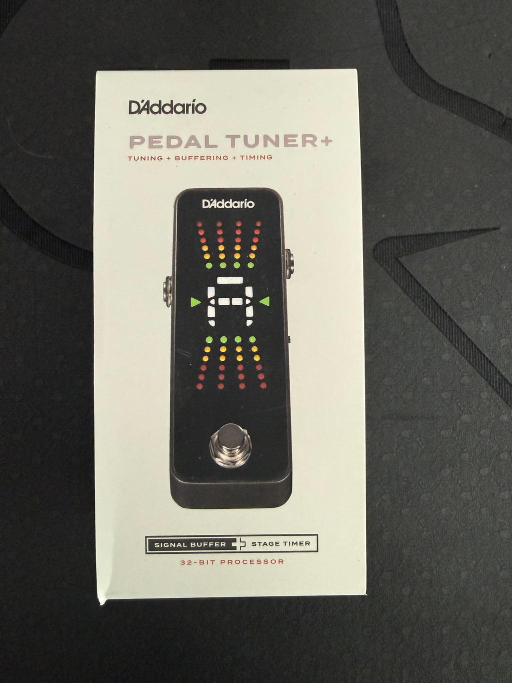 Chromatic pedal guitar tuner by Palm Harbor Music featuring a compact design and colorful display for accurate tuning.
