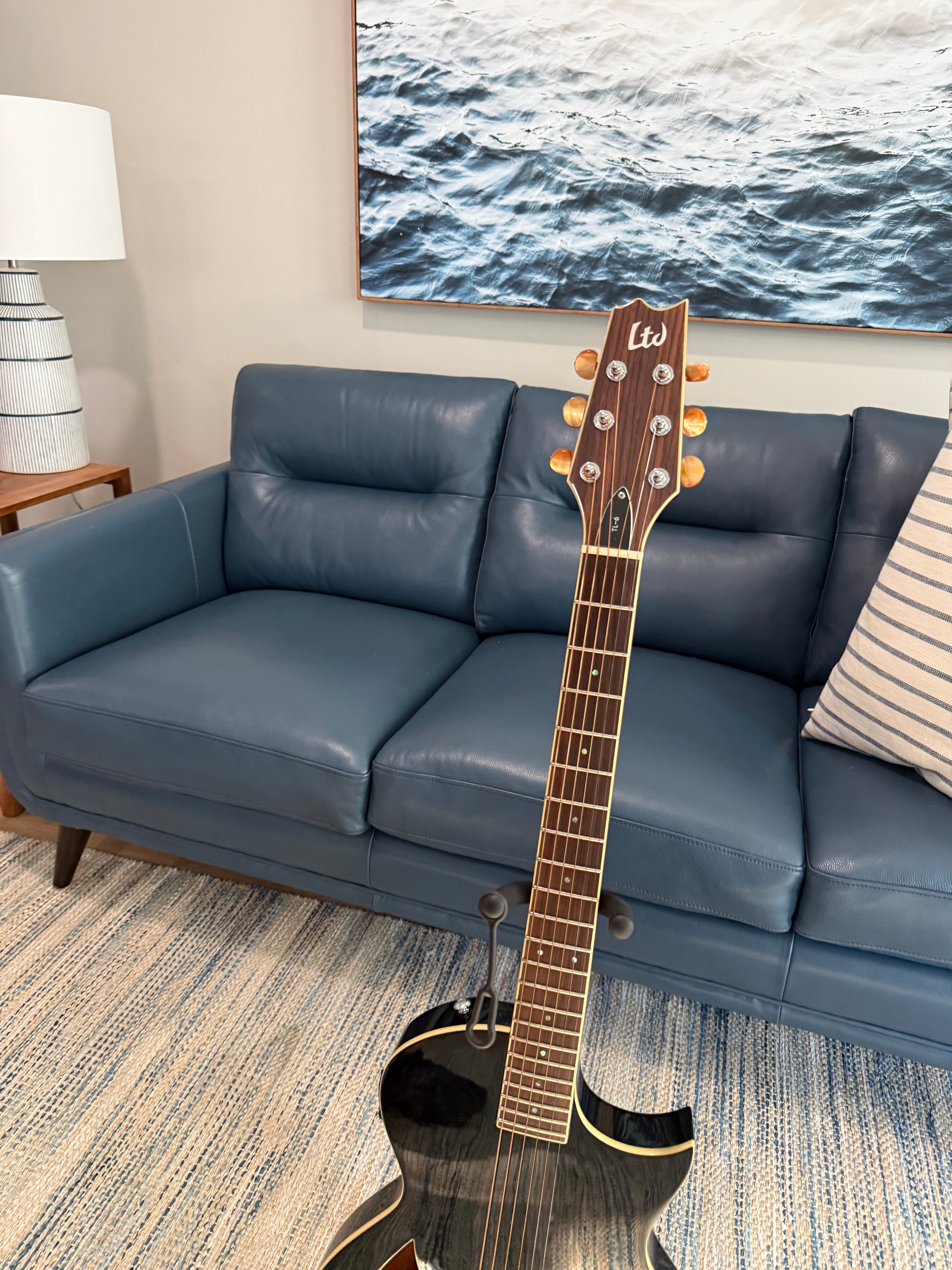 2017 ESP LTD TL-6 electric bass guitar with rosewood fretboard in black, displayed with a gig bag and a natural wood finish.