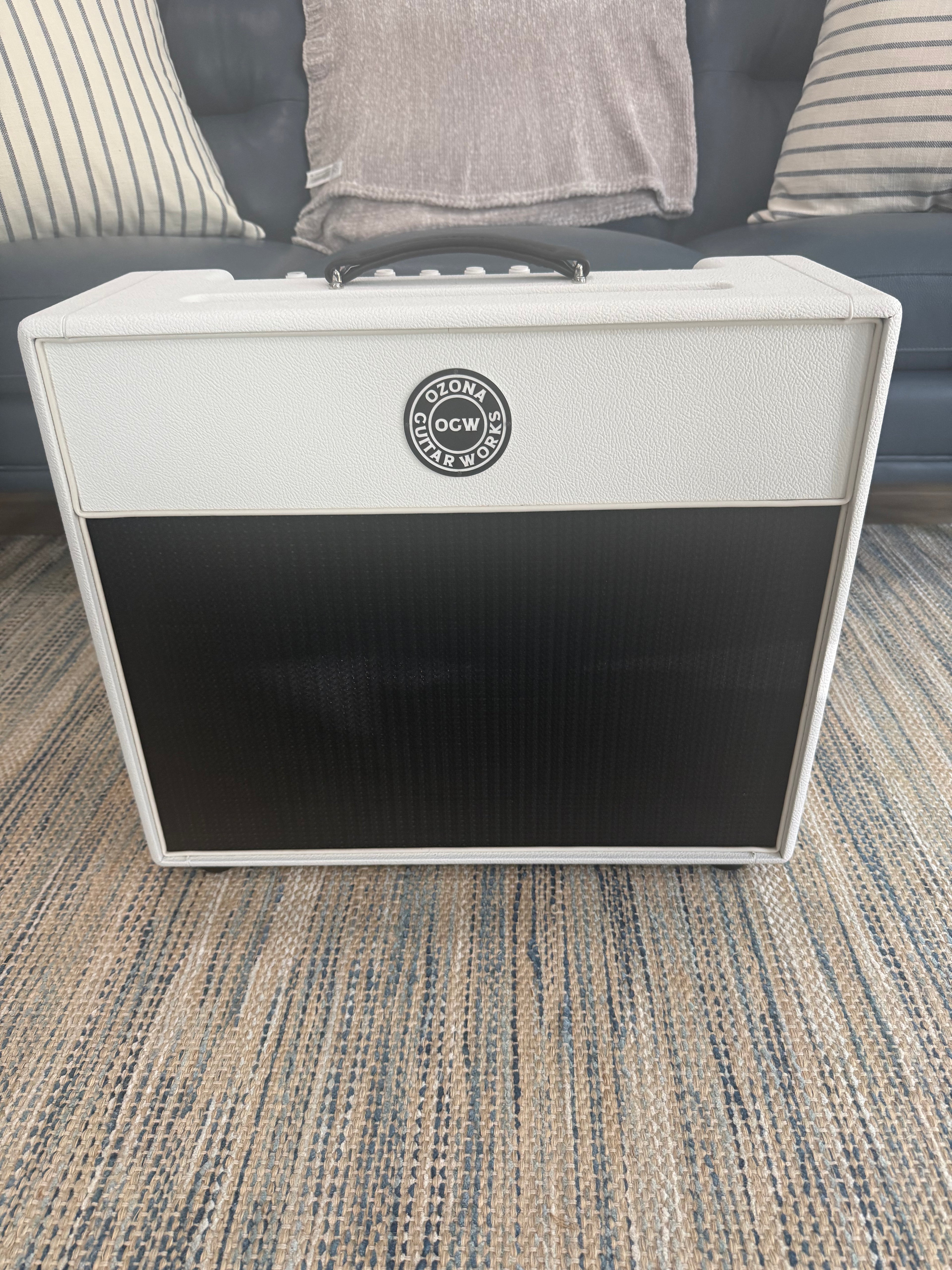 White Sand 45 Amp by Palm Harbor Music with sleek design and knobs, showcasing its modern features on a wooden surface.