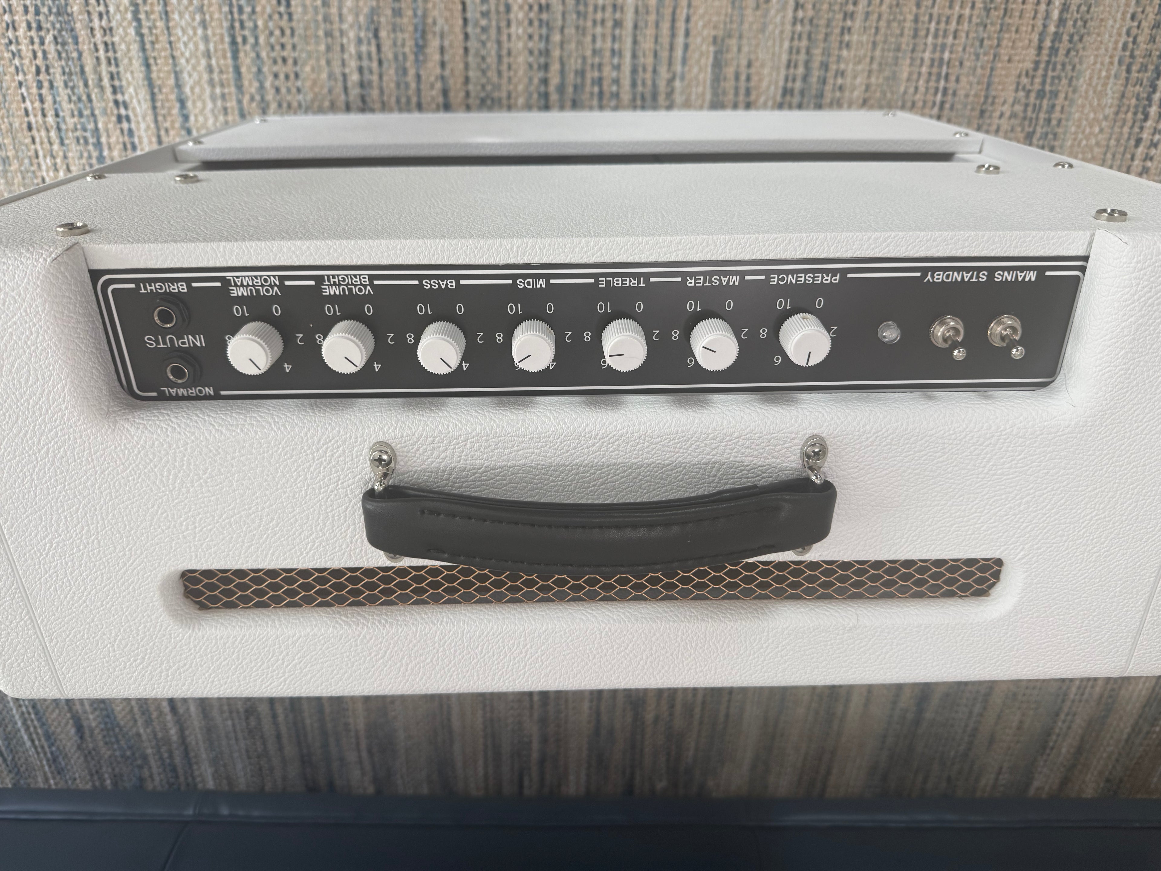 White Sand 45 Amp by Palm Harbor Music with a sleek design and vibrant color, showcasing its front panel and controls.