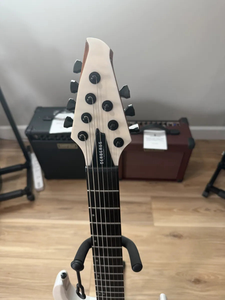 Cerberus Atlas 7 String guitar in Olympian White, showcasing sleek body design and elegant hardware details.