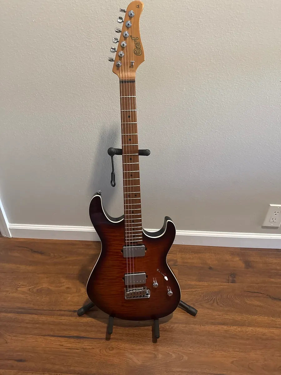 Used Cort G290 FAT II 2022 electric guitar with a sleek body and distinct finish, showcasing its unique design details.