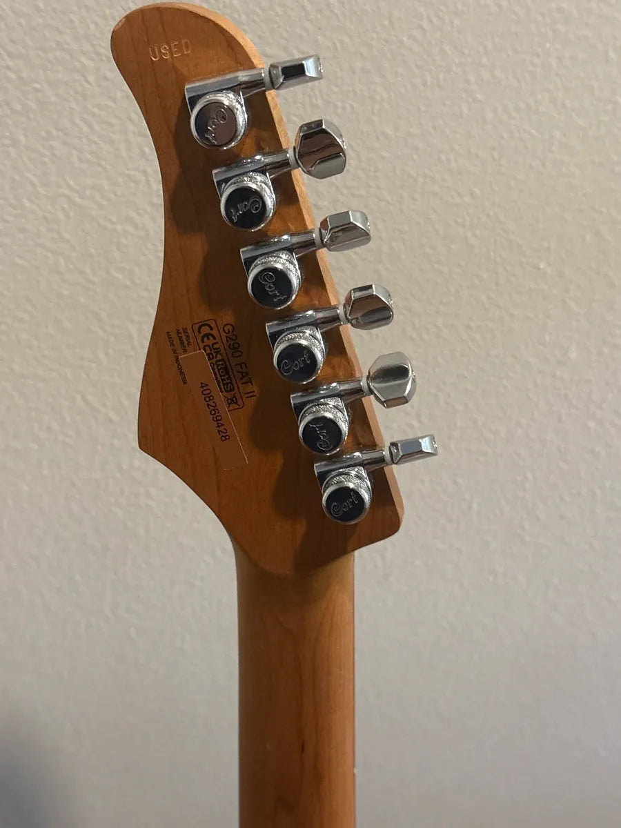 Used Cort G290 FAT II 2022 electric guitar in a sleek design, showcasing its body shape and finish.
