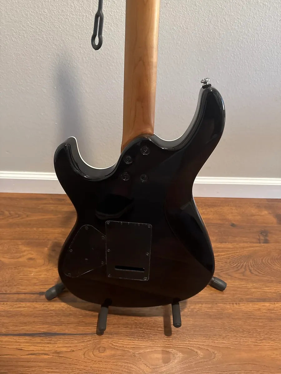 Used Cort G290 FAT II 2022 electric guitar with a sleek body and vibrant finish, showcasing its unique design.