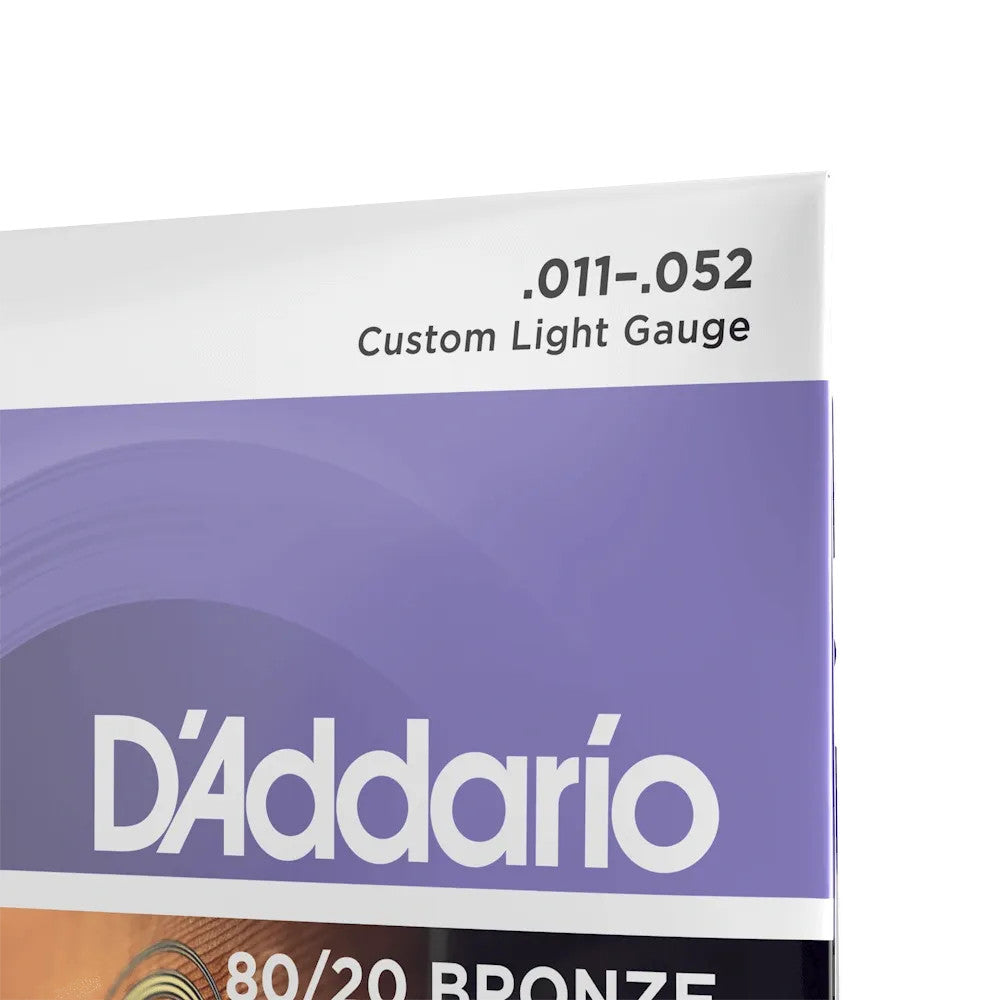D'Addario EJ13 80/20 Bronze Acoustic Guitar Strings set, custom light gauge 11-52, displayed in packaging.