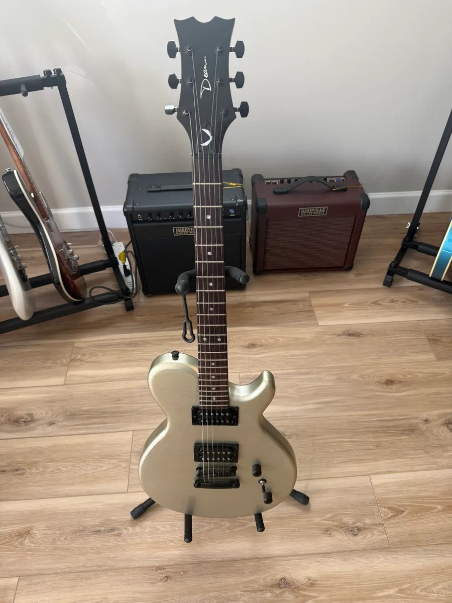 Used Dean Guitars EVO XM MSL electric guitar in metallic silver with dual humbuckers and solid body design.