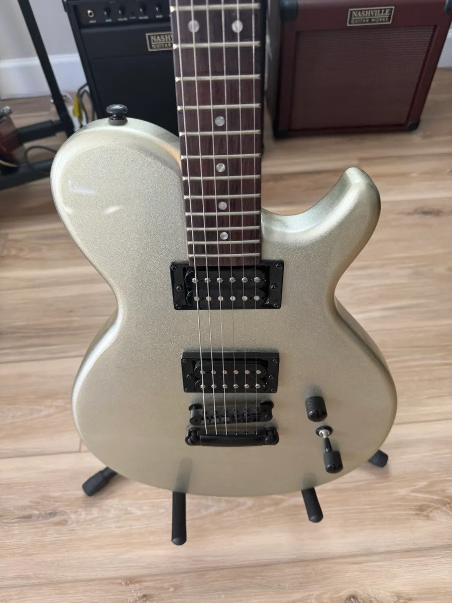Used Dean EVO XM MSL electric guitar in metallic silver with dual humbuckers and solid body design.