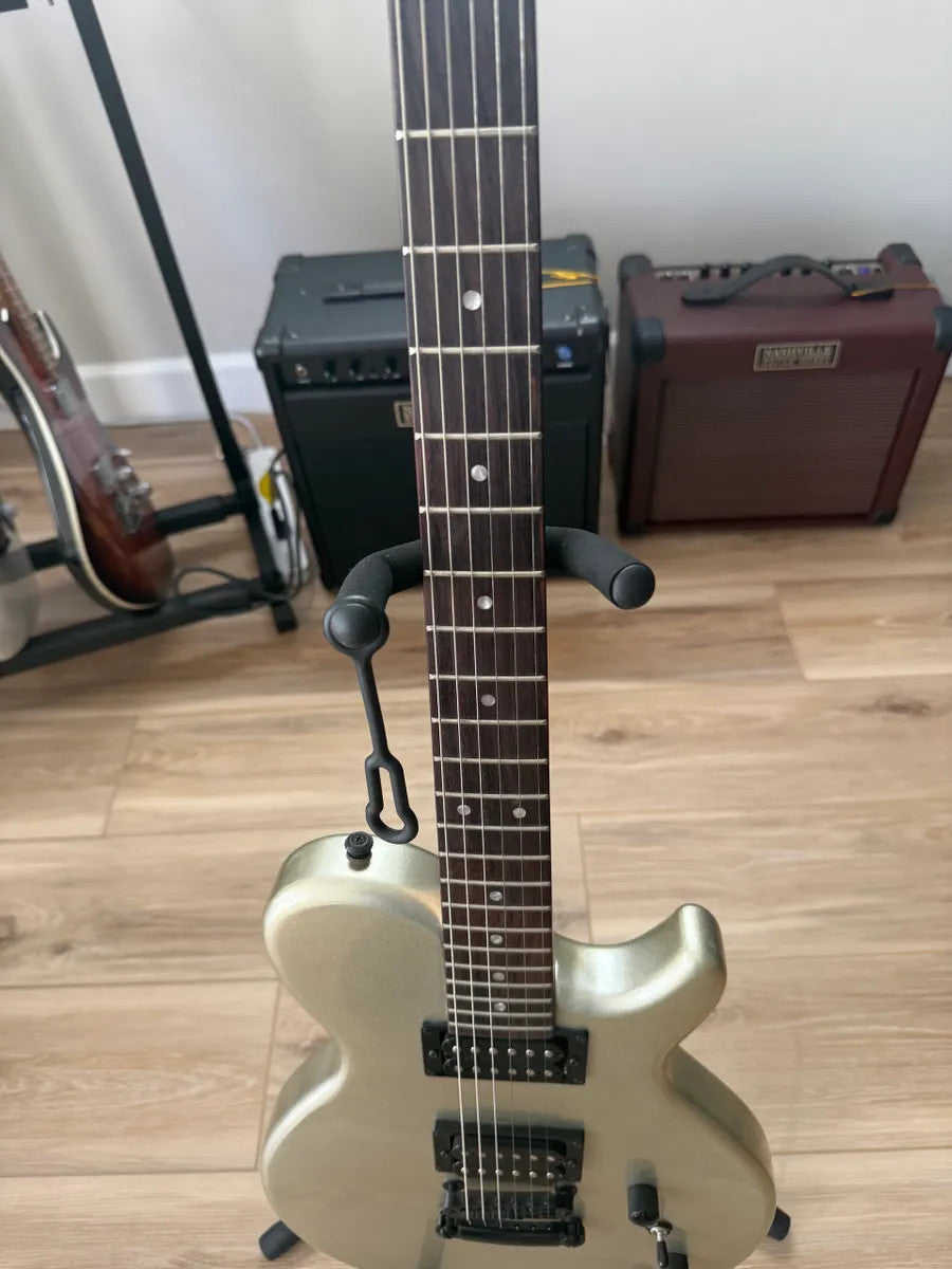 Used Dean Guitars EVO XM MSL electric guitar in metallic silver with dual humbuckers and solid body design.