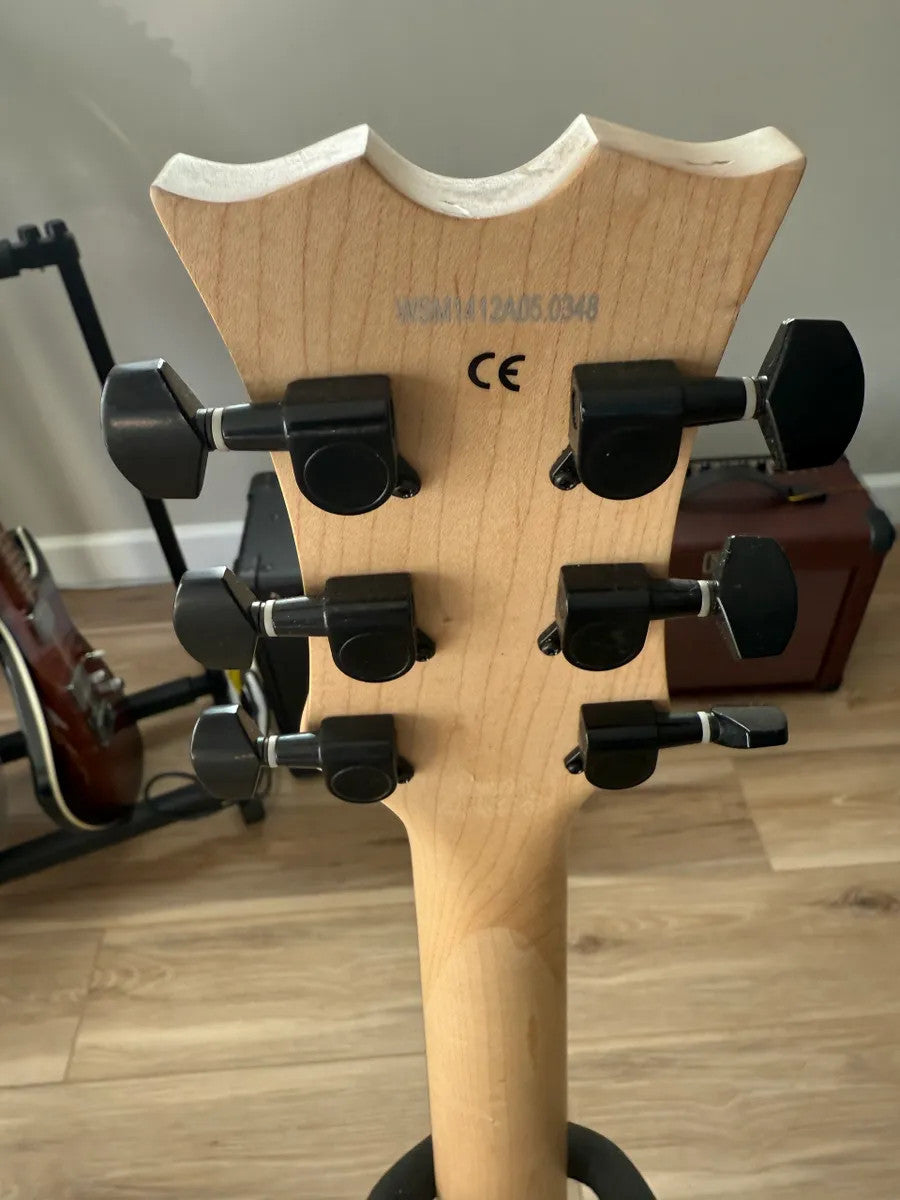 Dean EVO XM MSL electric guitar in metallic silver with dual humbuckers and solid body design.