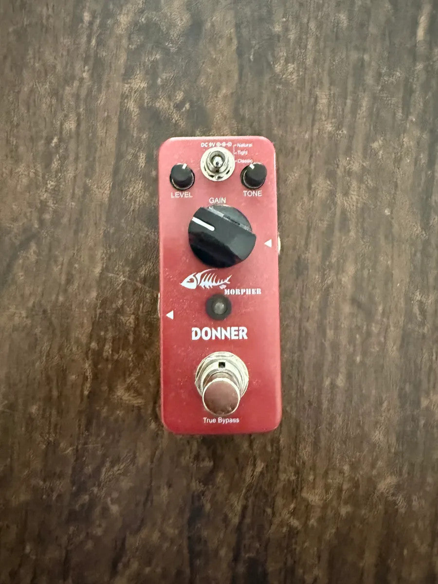Used Donner Morpher Distortion Guitar Effects Pedal featuring three tonal options and a classic tight design.