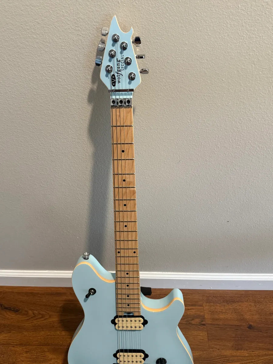 Used EVH Wolfgang Special in Sonic Boom finish with unique design and sleek body shape, showcasing its vibrant colors.