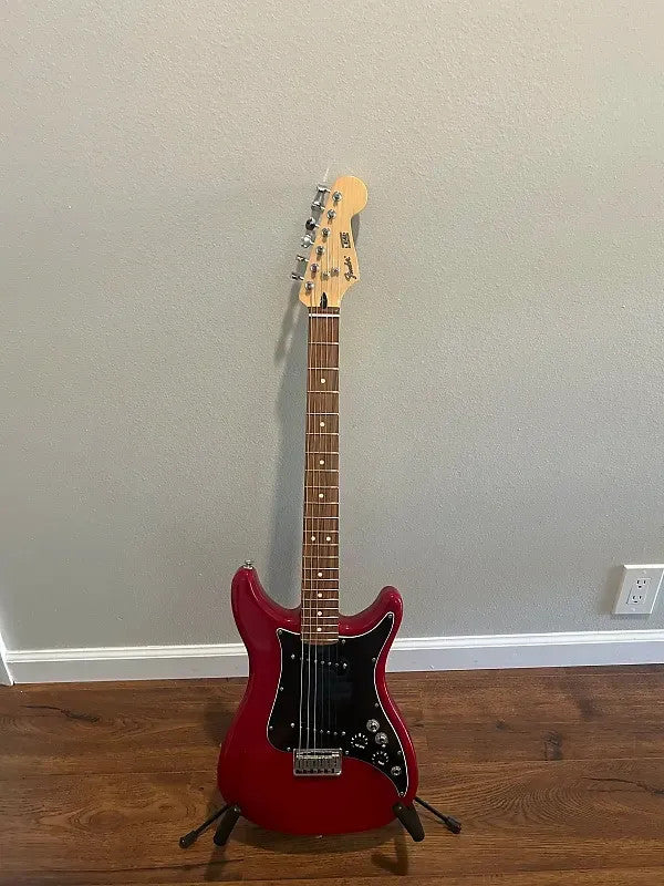 Used Fender Player Lead II guitar in Crimson Red Transparent finish with a sleek body design.