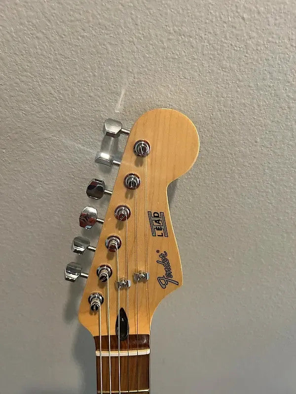 Used Fender Player Lead II 2020 in Crimson Red Transparent with a sleek design and vintage-style pickups.