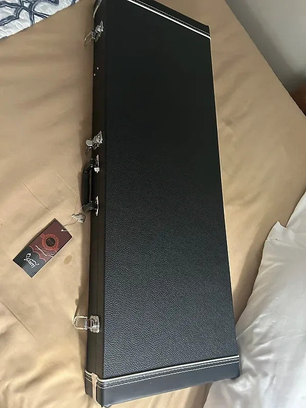 Fender Player Lead II electric guitar in crimson red transparent finish, showcasing its sleek body and chrome hardware.