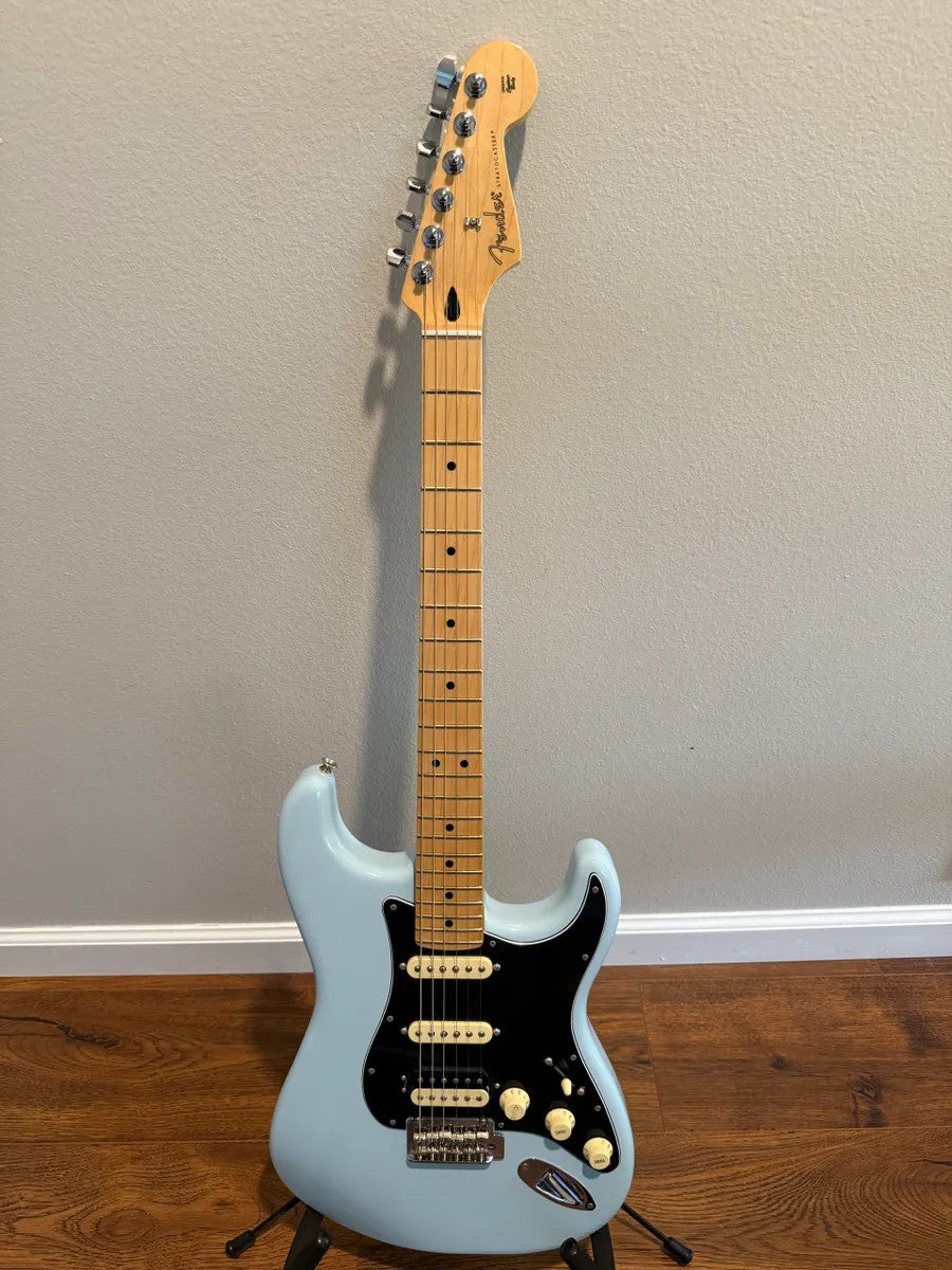 Used Fender Player Stratocaster HSS in Sonic Blue, showcasing its solid body and classic electric guitar design.