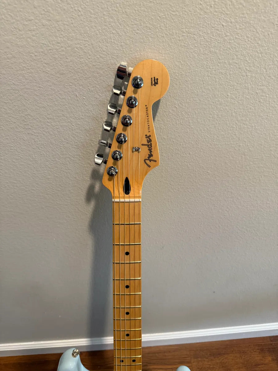 Used Fender Player Stratocaster HSS in Sonic Blue with solid body and chrome hardware, showcasing a classic electric guitar design.