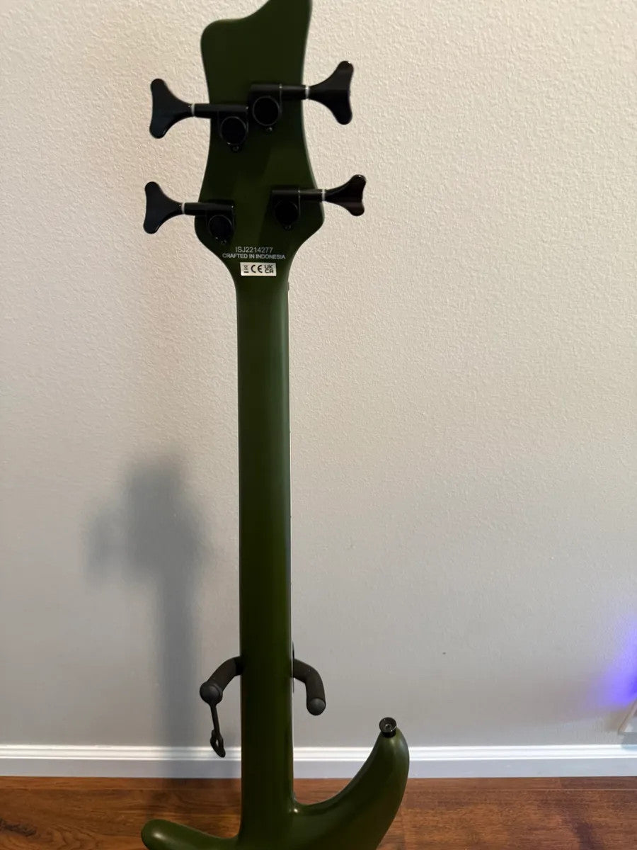 Used Jackson X Series Spectra SBX IV electric bass guitar in matte army drab finish with four strings and sleek design.