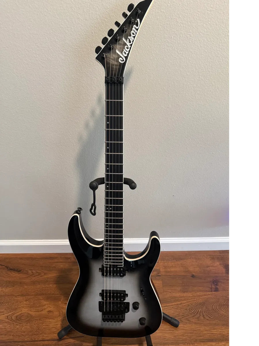 Used Jackson Pro Plus Series Dinky DKAQ in Ghost Burst finish, featuring a sleek body and distinctive design.