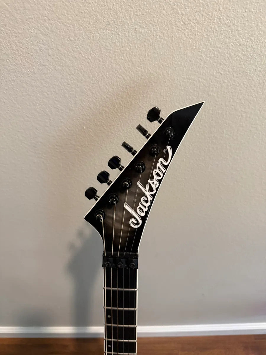 Used Jackson Pro Plus Series Dinky DKAQ in Ghost Burst finish, showcasing sleek body and unique color pattern.