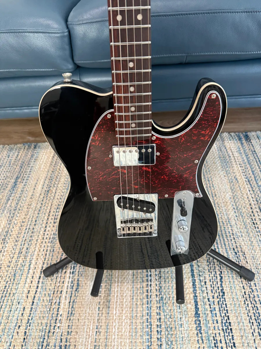 Jet Guitars JT-350 BK R electric guitar with a sleek black finish and stylish body design.