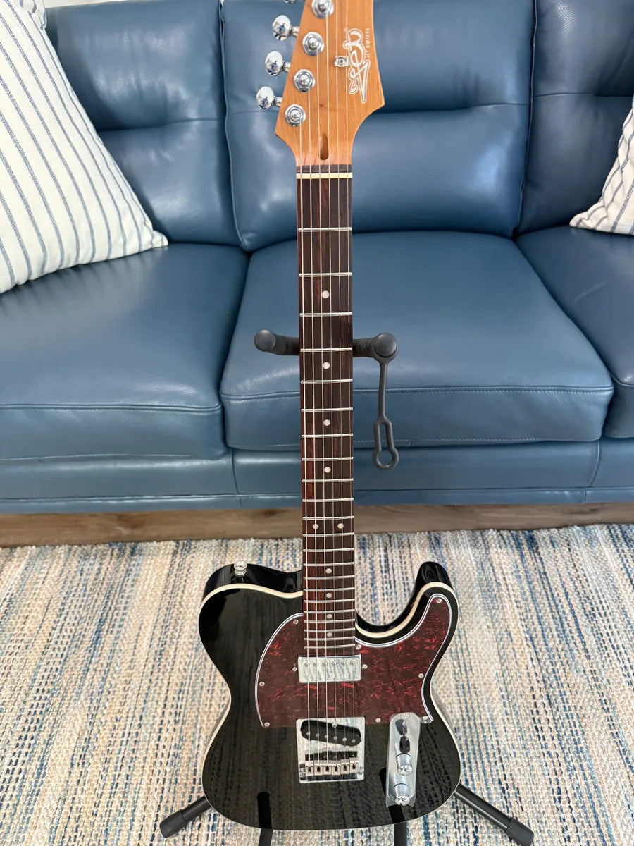 Black Jet Guitars JT-350 BK R electric guitar with sleek design and chrome hardware displayed against a neutral background.
