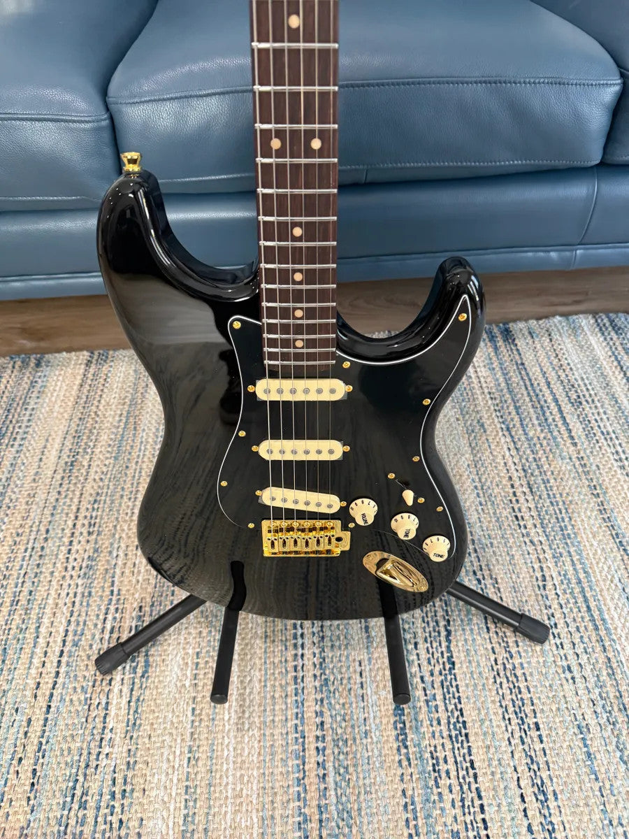 Jet Guitars JS-380 BK G electric guitar with a sleek black finish and stylish design, showcasing its body and neck.