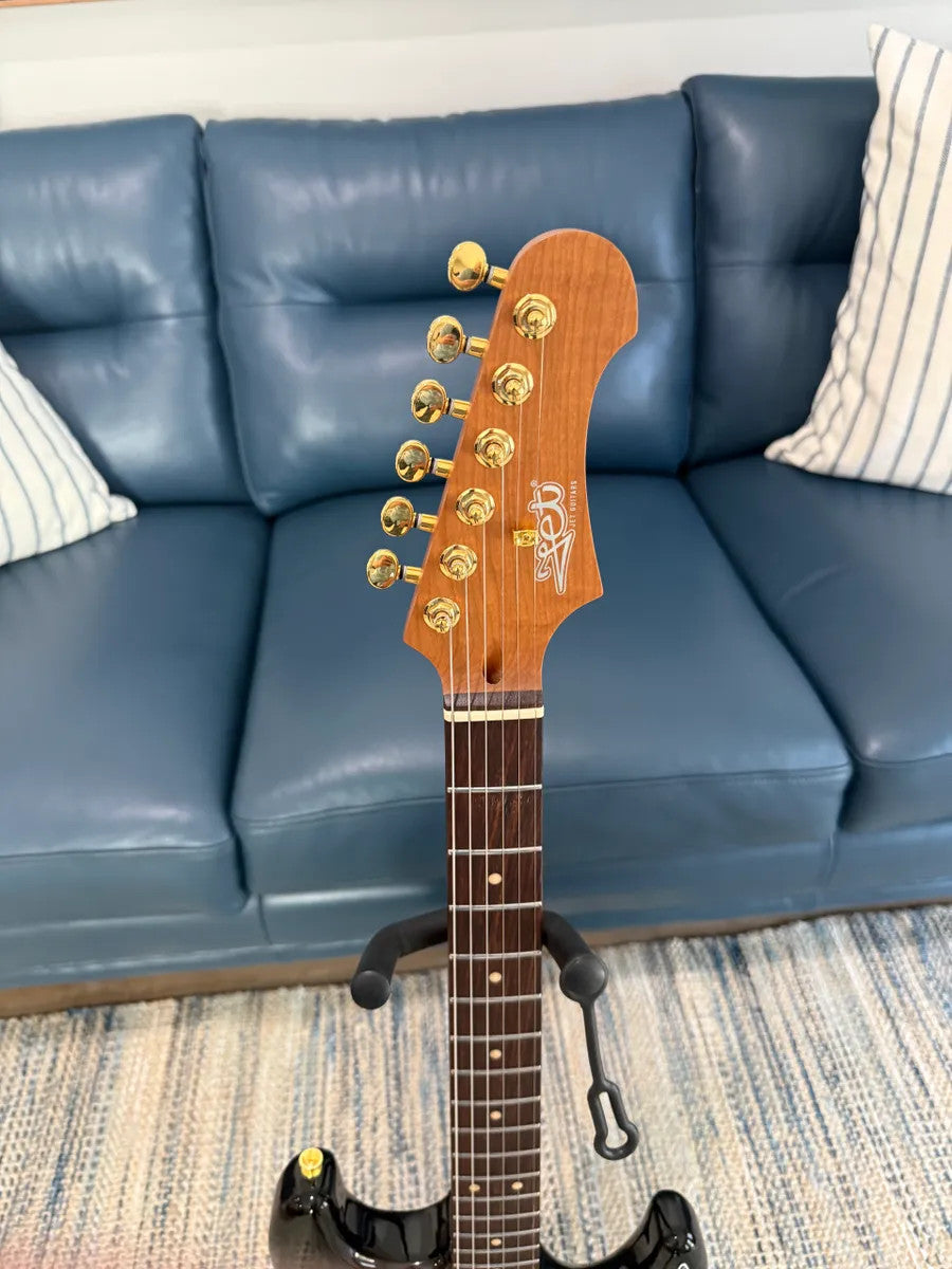 Jet Guitars JS-380 BK G electric guitar with a sleek black finish and stylish design.