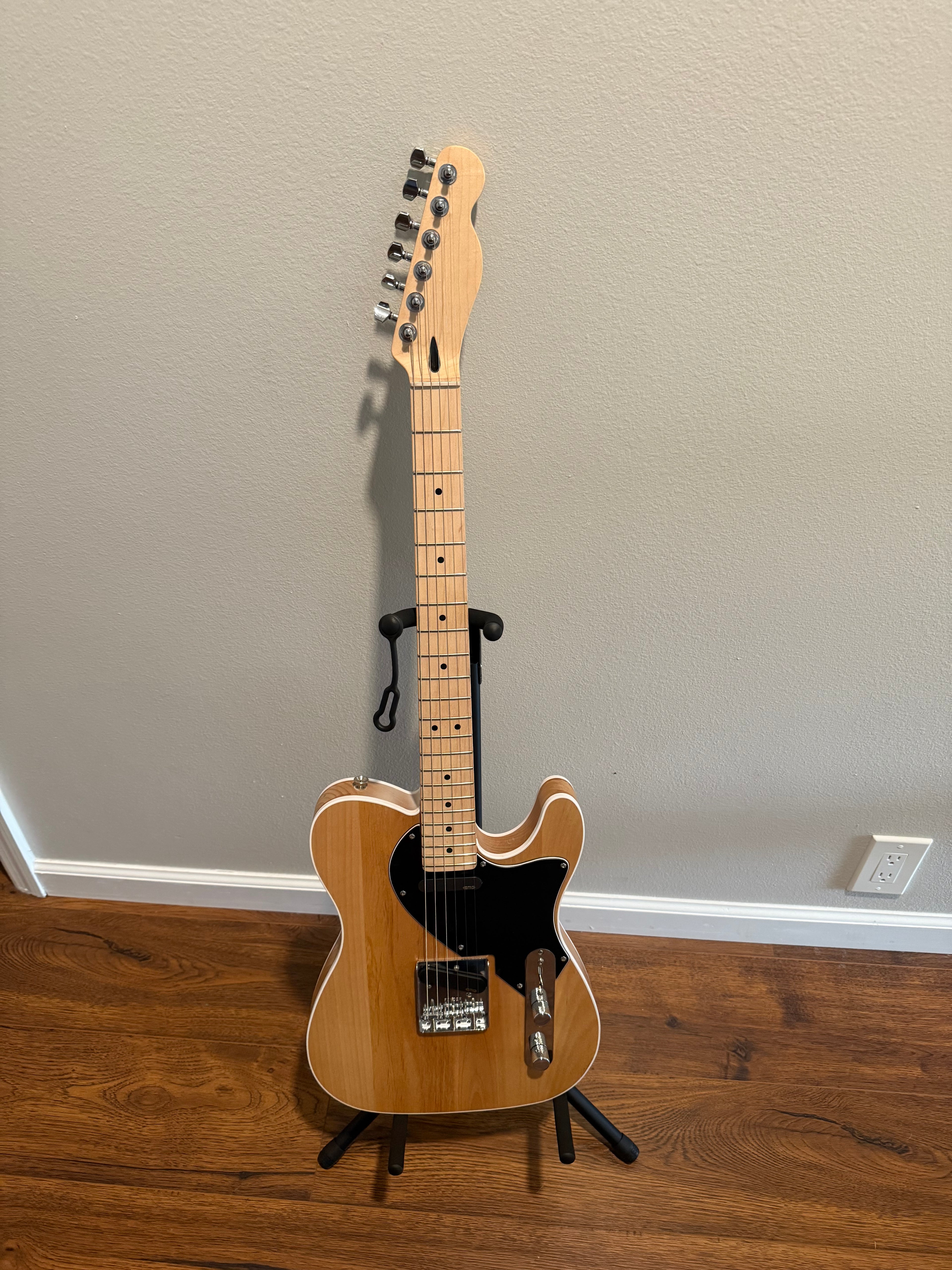 Custom Telecaster by Palm Harbor Music featuring a sleek design and vibrant finish on a wooden body.